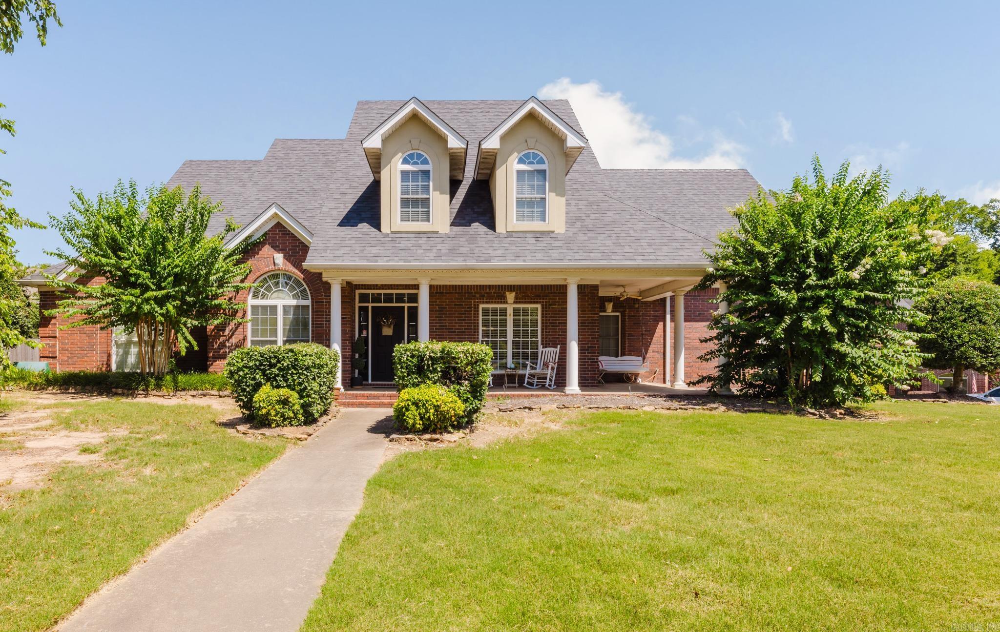 Well-maintained home in the highly desirable Hurricane Lake Estates offering plenty of room to spread out! Situated on a spacious corner lot, this home features a 3-car side-entry garage and an open-concept layout perfect for everyday living and entertaining. The updated kitchen boasts granite countertops, a large breakfast bar, breakfast nook, separate dining room, and an oversized pantry that also serves as a storm shelter. Enjoy newer LVP flooring, a wood-burning fireplace with gas starter, a dedicated office, and a spacious laundry room. The primary suite offers private patio access, double vanities, a jetted tub, walk-in shower, and a huge walk-in closet. Upstairs you'll find three generously sized bedrooms, each with walk-in closets, plus a bonus living area. Outside, relax on the covered patio overlooking the fully fenced backyard. Additional highlights include a massive floored walk-up attic, abundant storage throughout, a roof that's only 4 years old, and water heaters replaced 5 years ago. Conveniently located just moments from all the amenities Hurricane Lake Estates has to offer.