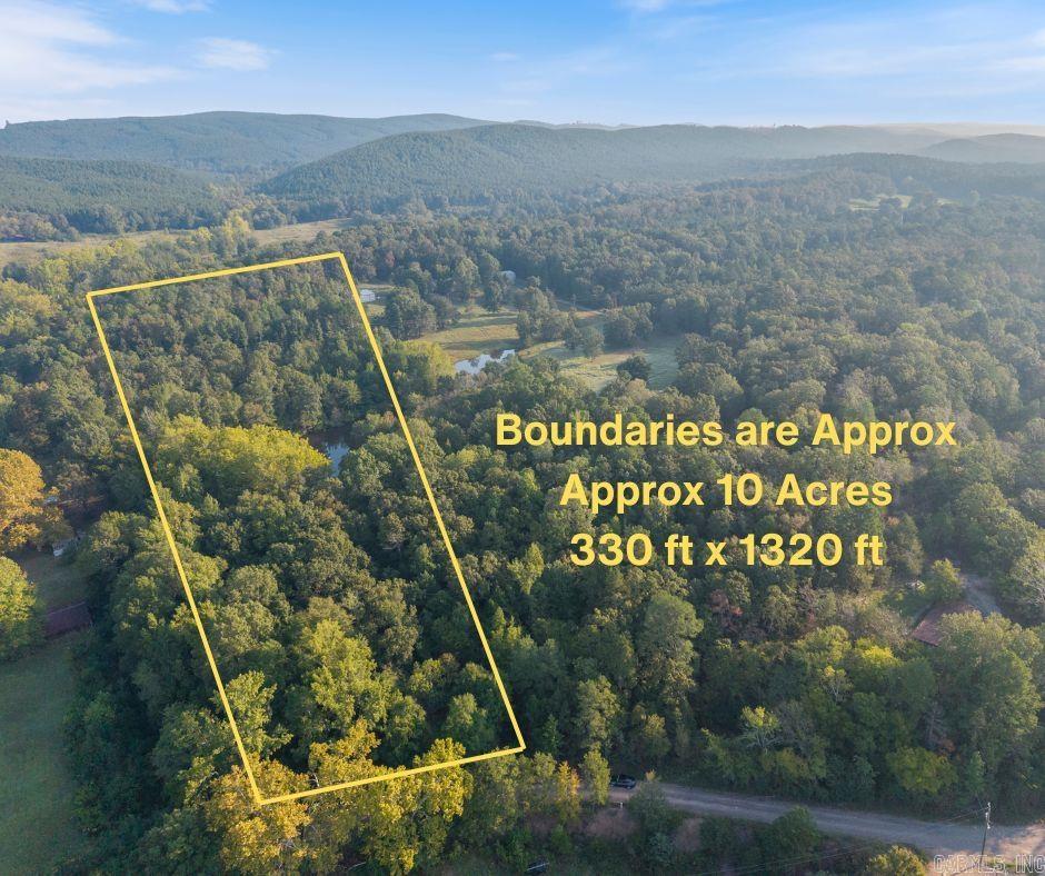 10 wooded acres inside the Perryville city limits? Yep — this is the kind of property people wait for. Tucked among towering hardwoods with rolling terrain and a natural pond, this land gives you that peaceful, tucked-away feeling while still keeping you close to town. Build your dream home, create a weekend getaway, or finally claim the space you’ve been dreaming about for outdoor living, trails, campfires, and quiet mornings surrounded by nature. Electric is available at the road, and city water is nearby. Buyer will need to verify availability and connection options with the city. Located about 35 minutes from Conway, 20 minutes from Morrilton, and 45 minutes from Little Rock, this is that rare mix of “I can breathe out here” and “I’m still close to everything.”