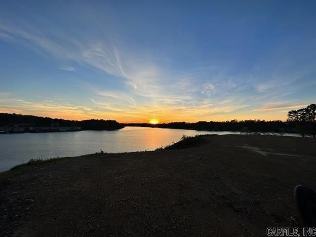 Stunning Main Channel Lot on Lake Hamilton- Premier Location! Discover the ultimate lakefront lifestyle with the exceptional Lake Hamilton Lot 3, located in a brand new, exclusive Subdivision. Perfectly positioned on the main channel, the property boasts 100ft of prime lake frontage and unmatched west-facing views of both north and south channels including the striking view of the 70 W. Bridge.  Enjoy breathtaking sunsets from your dream home's future deck or dock.  Owner/Agent, Bill of Assurance and Subdivision plat on file.