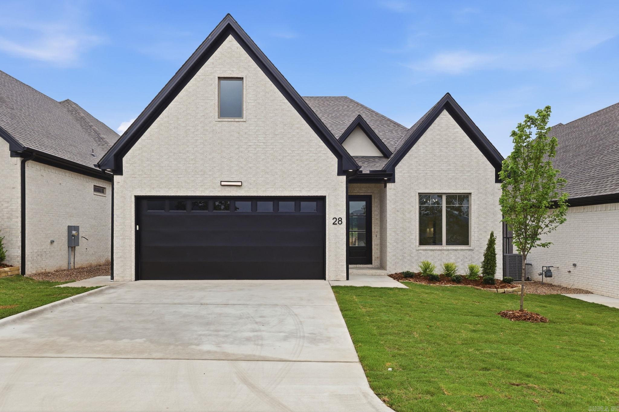 Welcome to Mountain Brook, West Little Rock's newest neighborhood, conveniently located off Highway 10 behind The Ranch. This single-level residence beautifully combines craftsmanship and design, featuring three bedrooms and two baths. The primary suite serves as a sanctuary with a spa-like bath, soaking tub, oversized walk-in shower, and a custom closet. The living room boasts soaring 12' ceilings and a floor-to-ceiling tiled fireplace. At the heart of the home is a chef’s kitchen equipped with quartz countertops, custom cabinetry, a dining area, and a fully functional pantry. You can also enjoy evenings by the outdoor fireplace.  Please contact the listing agent to schedule your private tour.