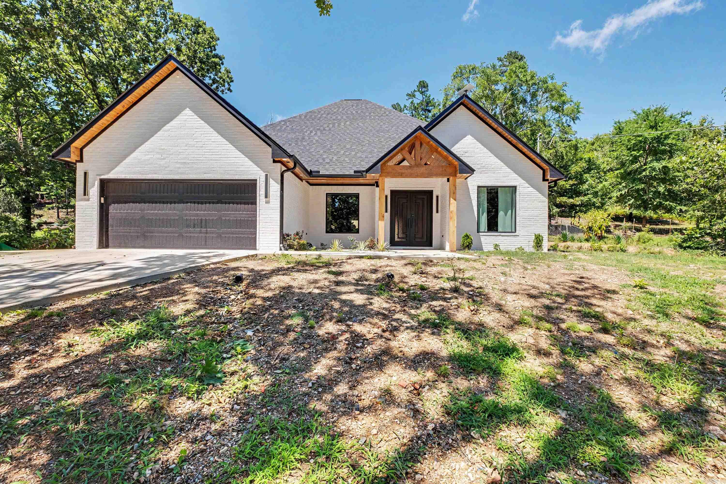 Modern elegance meets exceptional craftsmanship in this beautifully designed home. Featuring a striking white brick exterior with custom wood accents, an open-concept floor plan, designer finishes, and quality details throughout. Every space has been thoughtfully created to offer the perfect balance of style, comfort, and functionality. Move-in ready and designed to impress.