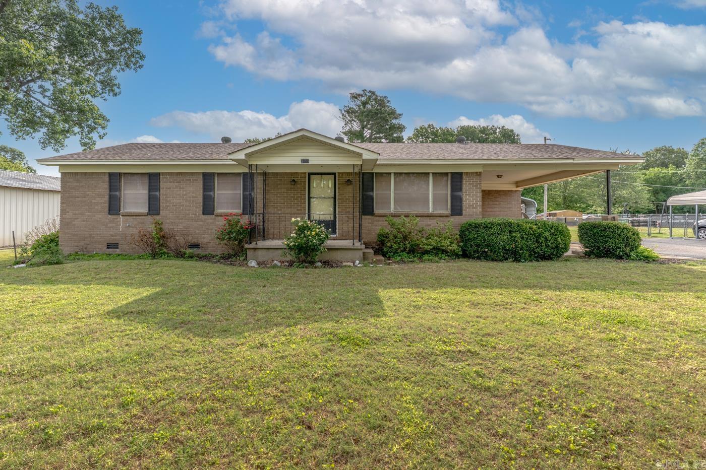 Charming country property just outside Wynne featuring nearly 2,000 square feet of living space on a spacious 0.84+/- acres lot. This classic 3 bedroom brick home offers a unique layout with a large sun porch, updated bathroom, central heat/cooling, laminate & carpet flooring, attached carport parking, fenced backyard and peaceful rural surroundings along Highway 284. The property combines vintage character with functional outdoor space, making it ideal for buyers seeking privacy and room to expand. Property also has a 24 x 38 shop building with metal roof.
