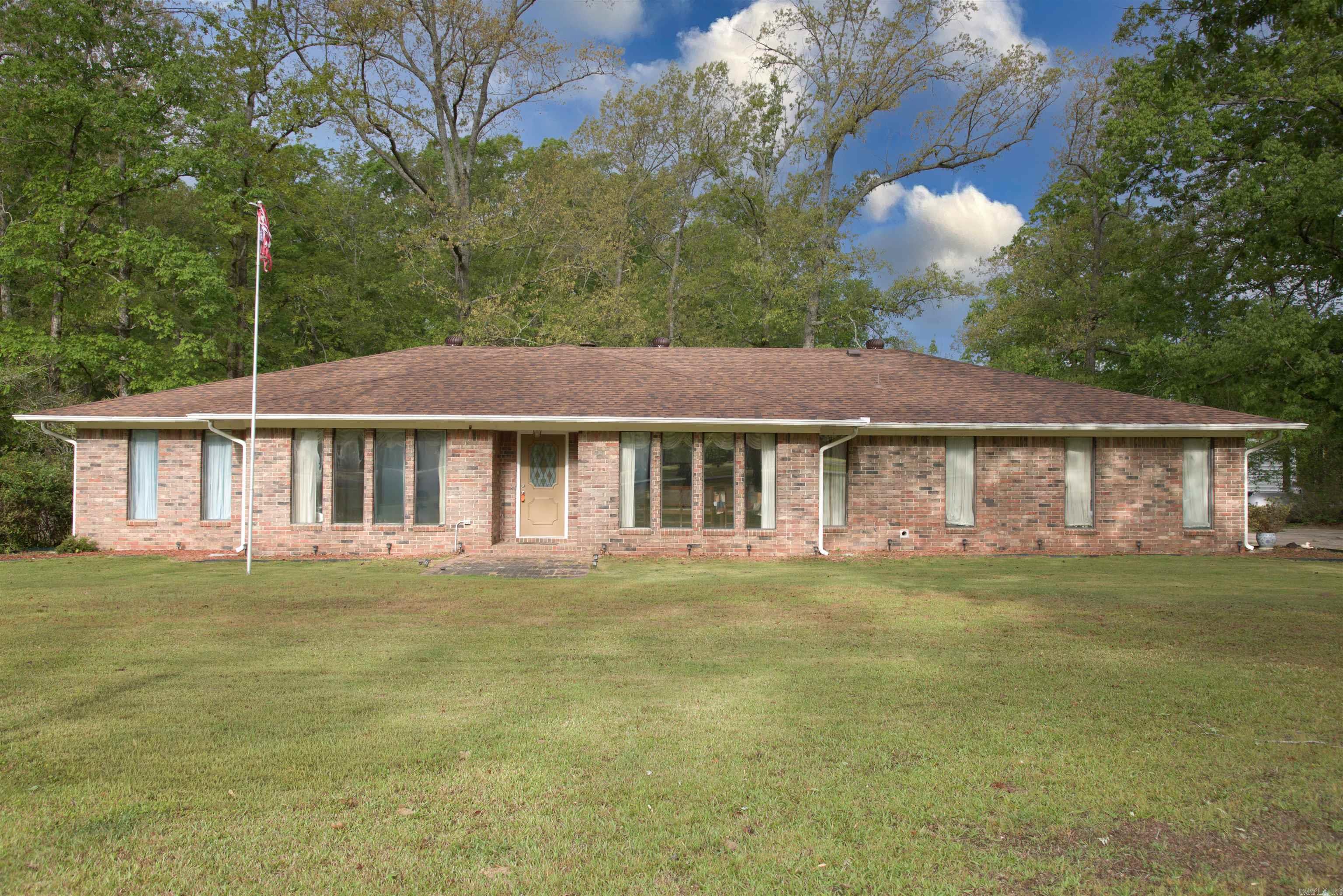 Welcome to your private slice of country living! This very well-maintained 3-bedroom, 2.5-bath home sits on nearly 2 acres, offering space, comfort, and functionality both inside and out.  Step inside to find a thoughtfully designed layout featuring a dedicated office, a formal dining room, and a spacious kitchen complete with a beautiful island—perfect for cooking, gathering, and entertaining. French doors lead out to a stunning back patio and deck, thoughtfully designed for entertaining guests or simply relaxing and enjoying the outdoors.  Outside, you’ll love the large circle driveway for easy access and ample parking. The property also includes a versatile shop equipped with electricity and water, plus a convenient lean-to—ideal for storage, hobbies, or workspace needs.  Home comes with a whole home generator for unexpected outages!  With a brand-new roof installed in 2024 and a peaceful rural setting, this property may qualify for zero down financing options, making it an incredible opportunity for eligible buyers.  Enjoy the quiet lifestyle while still having all the space you need—this one is a must-see!