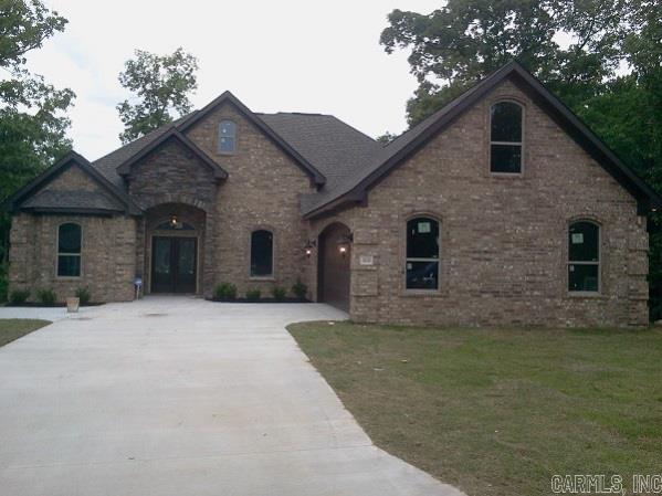 Warm & Inviting-This New Construction Sports 12ft Ceiling With Surround Sound, Extensive Crown Molding, Granite Counter Tops, Carpet, Wood Laminate & Ceramic Tile Flooring, Formal Dinning, Eat-In Kitchen, Stainless Appliances, Wall Oven & Farm Sink, Wine Cooler, Custom Built Dark Stained Cabinets Throughout, Master Bedroom Has Double Tray Ceiling, Master Bath Whirlpool Tub, Dual Vanity, Over Size Ceramic Tile Shower, Large Walk-In Closet With Built-In, Finished Bonus Room & Huge Covered Deck