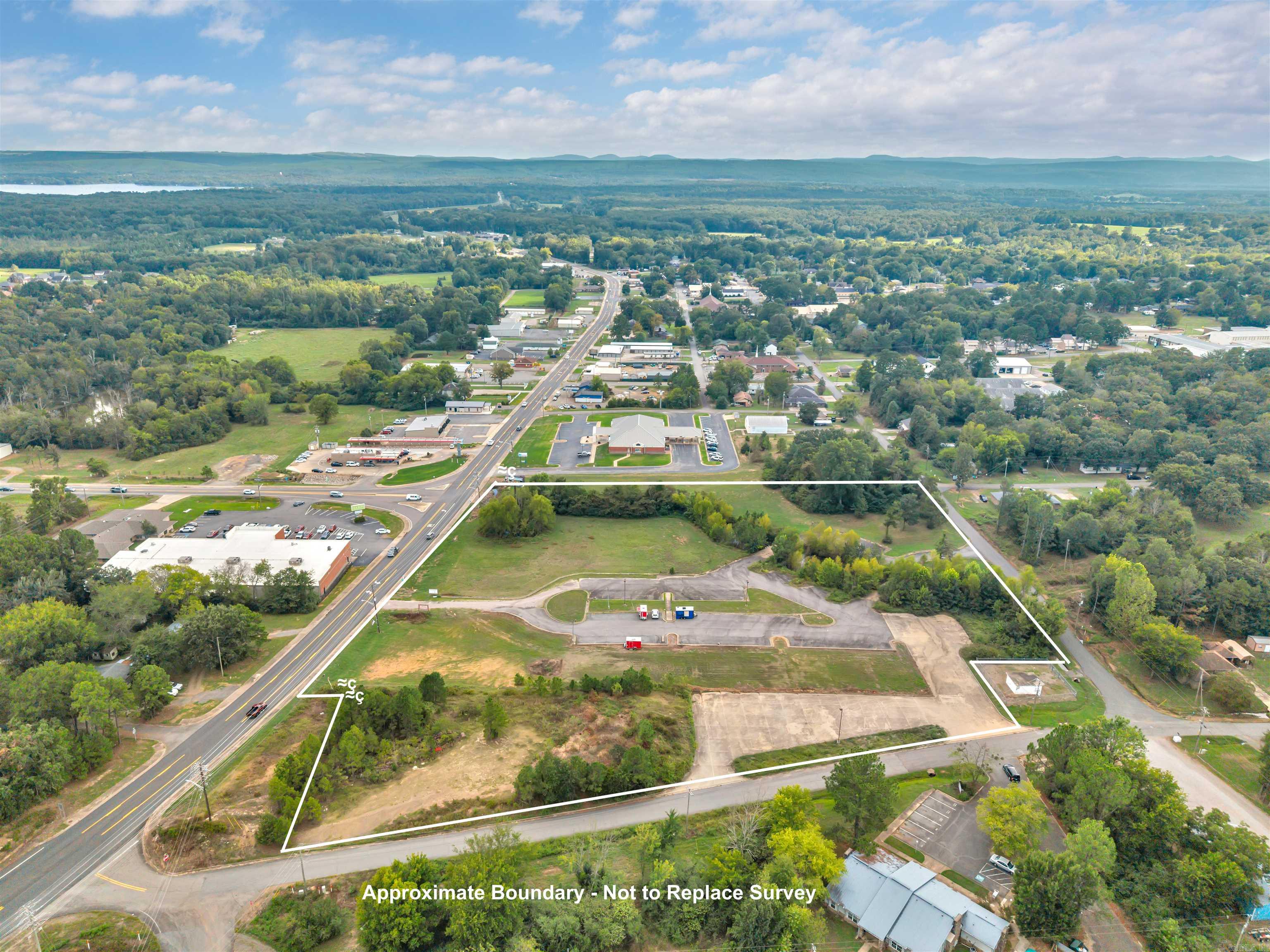 Great commercial acreage in a high-traffic area in the heart of Perryville, AR! This 7.75 acres already has paved parking throughout. As the county seat of Perry County, Perryville is home to numerous county offices, adding to the area’s steady flow of daily visitors. This site offers excellent visibility and accessibility. This acreage would really support any type of commercial or multi-family development. Land is currently used to rent food truck spaces. Electrical, water and sewer are on the property.