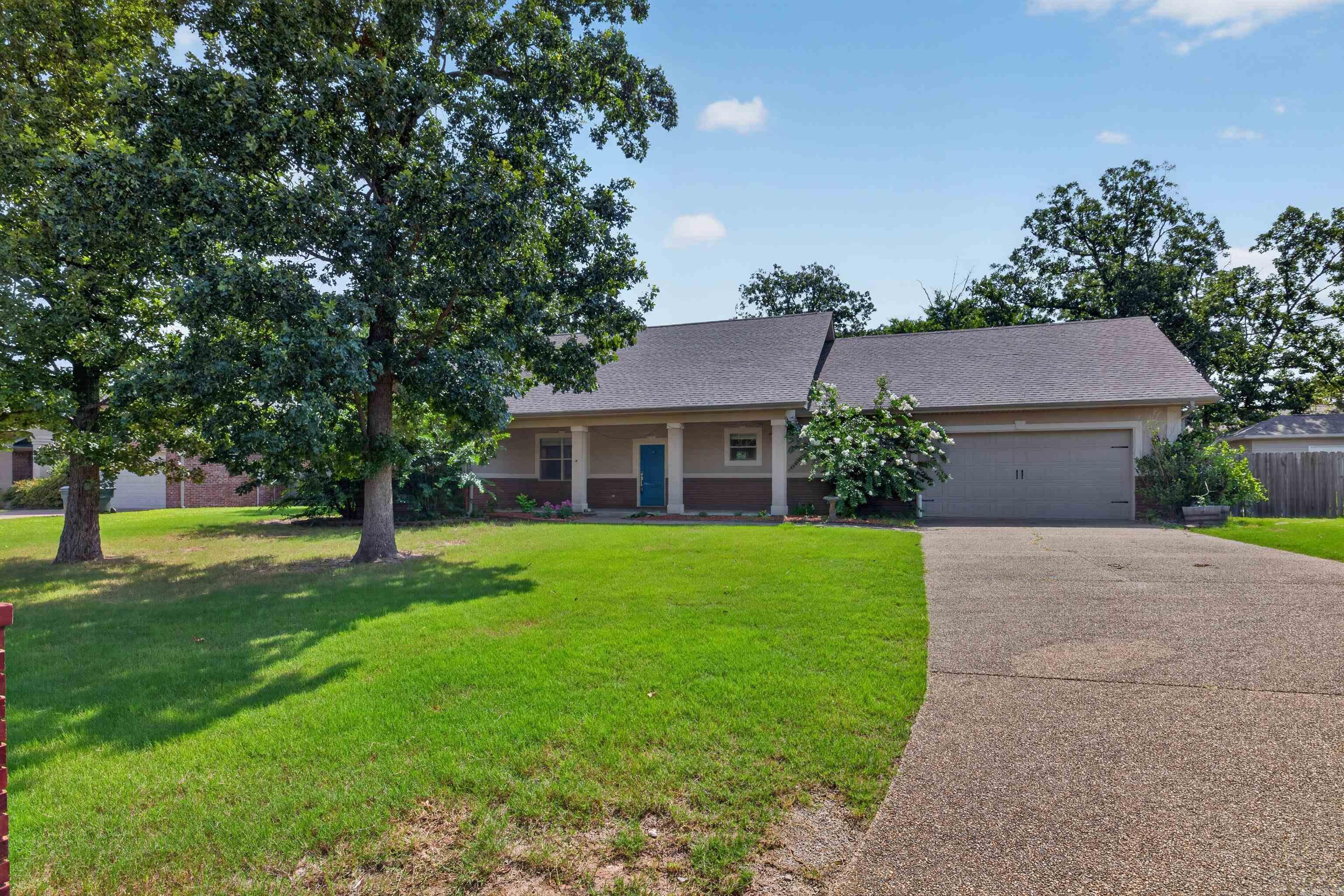 Looking for serenity? Relaxation? Look no further! This home is ready to call you home! Featuring a fully-fenced back yard, His-And-Hers Hobby shops, One of which is heated and cooled, with a HUGE Covered porch ripe for entertaining! Inside, the house itself is pulling its own weight, offering GORGEOUS granite countertops in the bathroom, hallway, kitchen, and half bath, and fresh paint throughout the home! Not to mention the absolutely GORGEOUS tile and hardwood flooring offered throughout the home.  Don't miss this one!