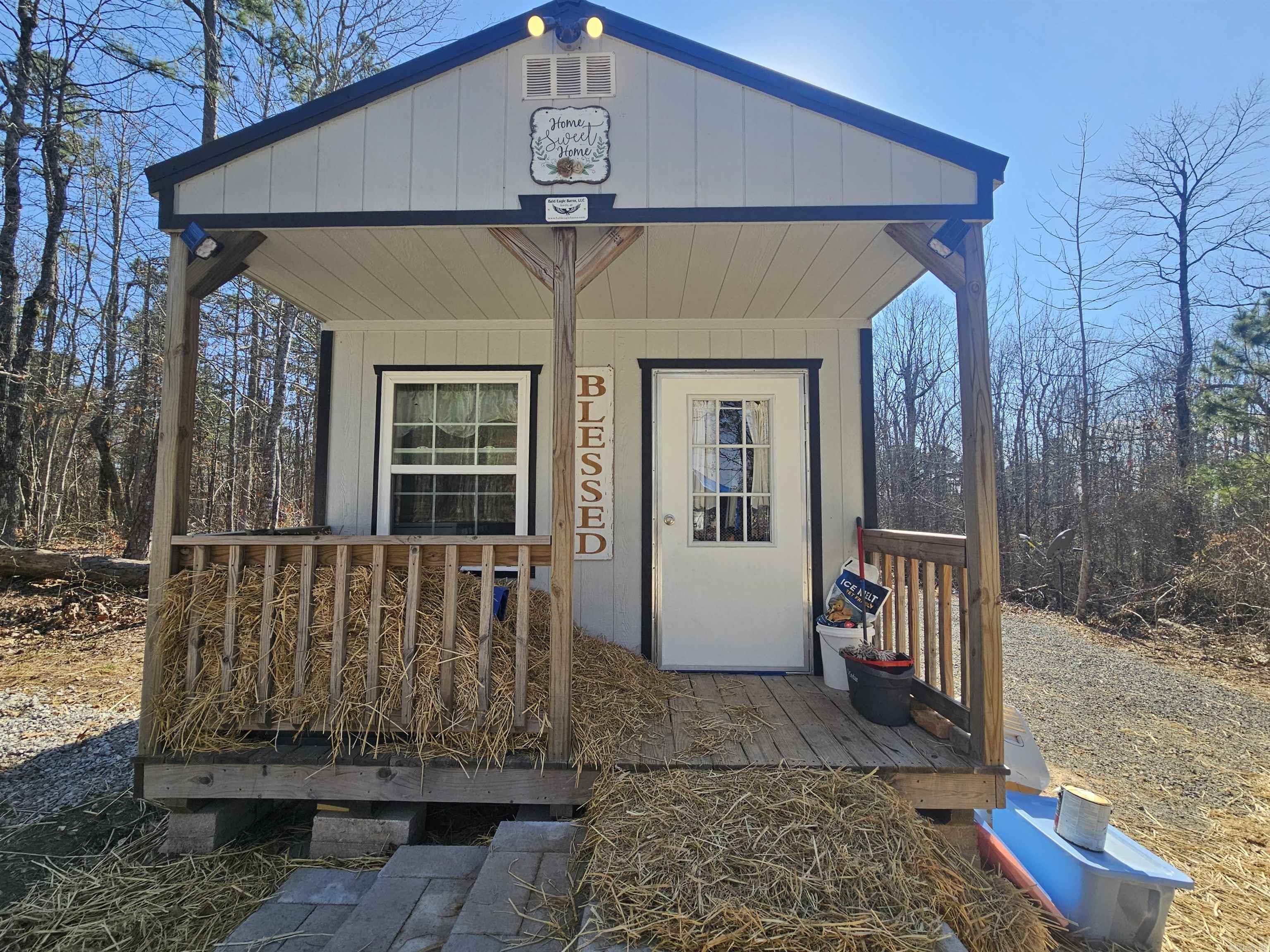 Tiny Barn Cabin on 5 Ozark Mountain Acres! This 12X32 Eagle Barn is in the process of being thoughtfully converted into a cozy home. The seller has spared no expense on quality improvements including Advantech subflooring, vapor barrier, and premium 2" foam board insulation. Inside you'll find a double basin utility sink in the kitchen area, and large 36" windows bringing in natural light and views of the surrounding countryside. Heating is provided by a direct-vent propane heater, and an additional propane line has been installed at the rear for a generator. Outside features include a frost-free hydrant. The land is level and fully usable, offering privacy, peace, and room to expand. With just a little more finishing work, this property could become a charming nightly rental, weekend retreat, or small homestead. Located near Mountain View and within easy reach of the White River, Greers Ferry Lake, and the Buffalo National River. Just a few miles from the local country store known for supplies and famous country cooking! Perfect for a getaway, Airbnb, weekend retreat, or homestead