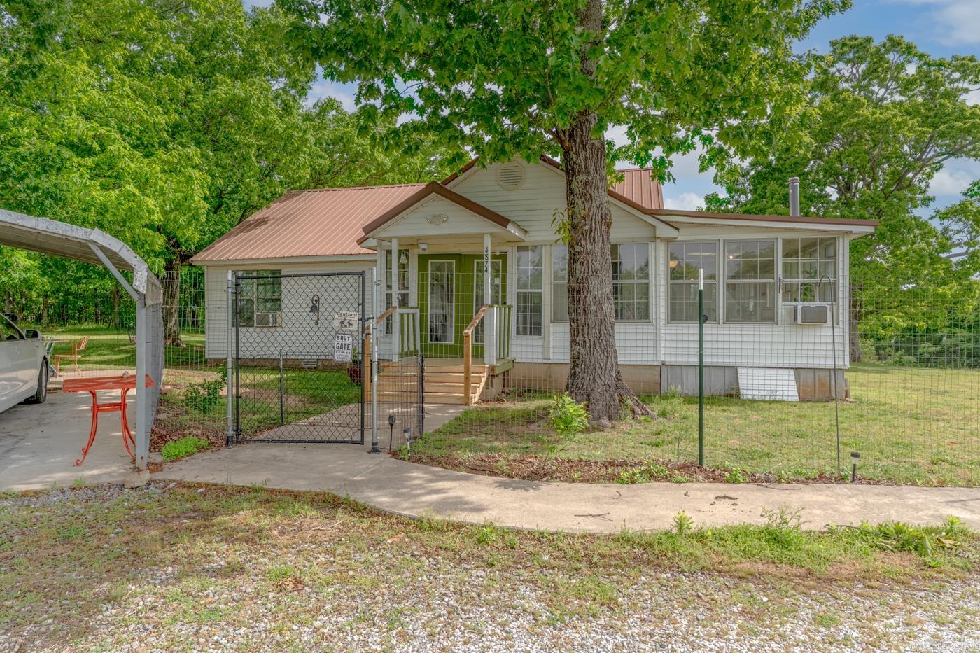 Have you been looking for a relaxing bungalow in the mountains with plenty of land to explore? 4874 Mountain View Road is an oasis found right off the highway outside of the quaint town of Mountain View. It features a newly remodeled kitchen with hardwood floors throughout. The soaking tub in the bathroom has a large picture window, overlooking the wooded property. It also boasts an additional 520 square feet of sunroom with windows running the length of the side of the home, perfect for a plant-lover.