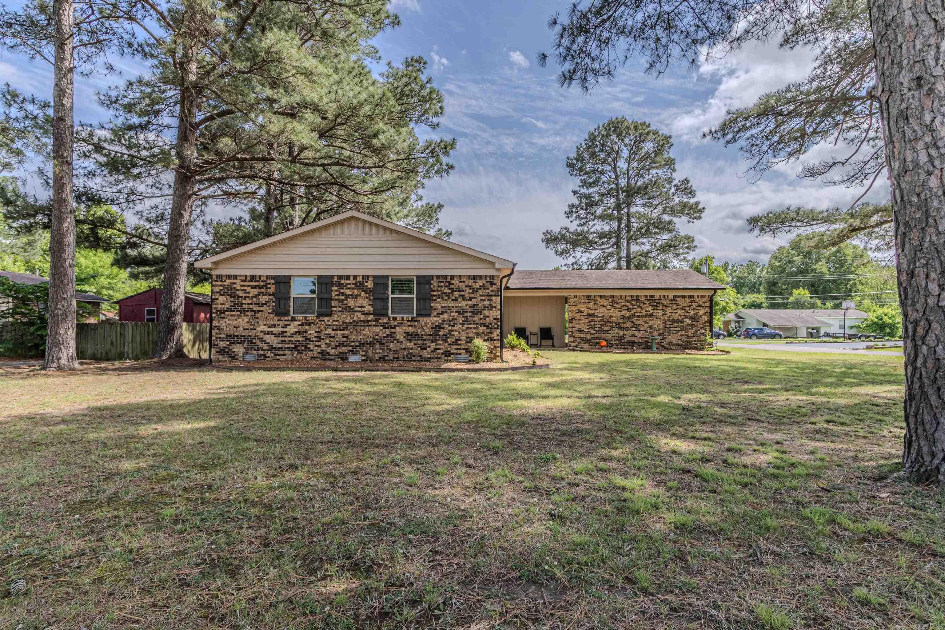 Move in ready and full of charm! This beautifully updated home offers an open floor plan with a spacious kitchen featuring gray cabinetry, island bar seating, pantry cabinet, and formal dining space. Sitting on a desirable corner lot, the backyard now includes a wood privacy fence for added seclusion plus a storage shed for extra functionality. Conveniently located near Reynolds Park, Wal-Mart, and the movie theater, you’ll love how close this home is to everything while still feeling tucked away. A great blend of space, updates, and location!