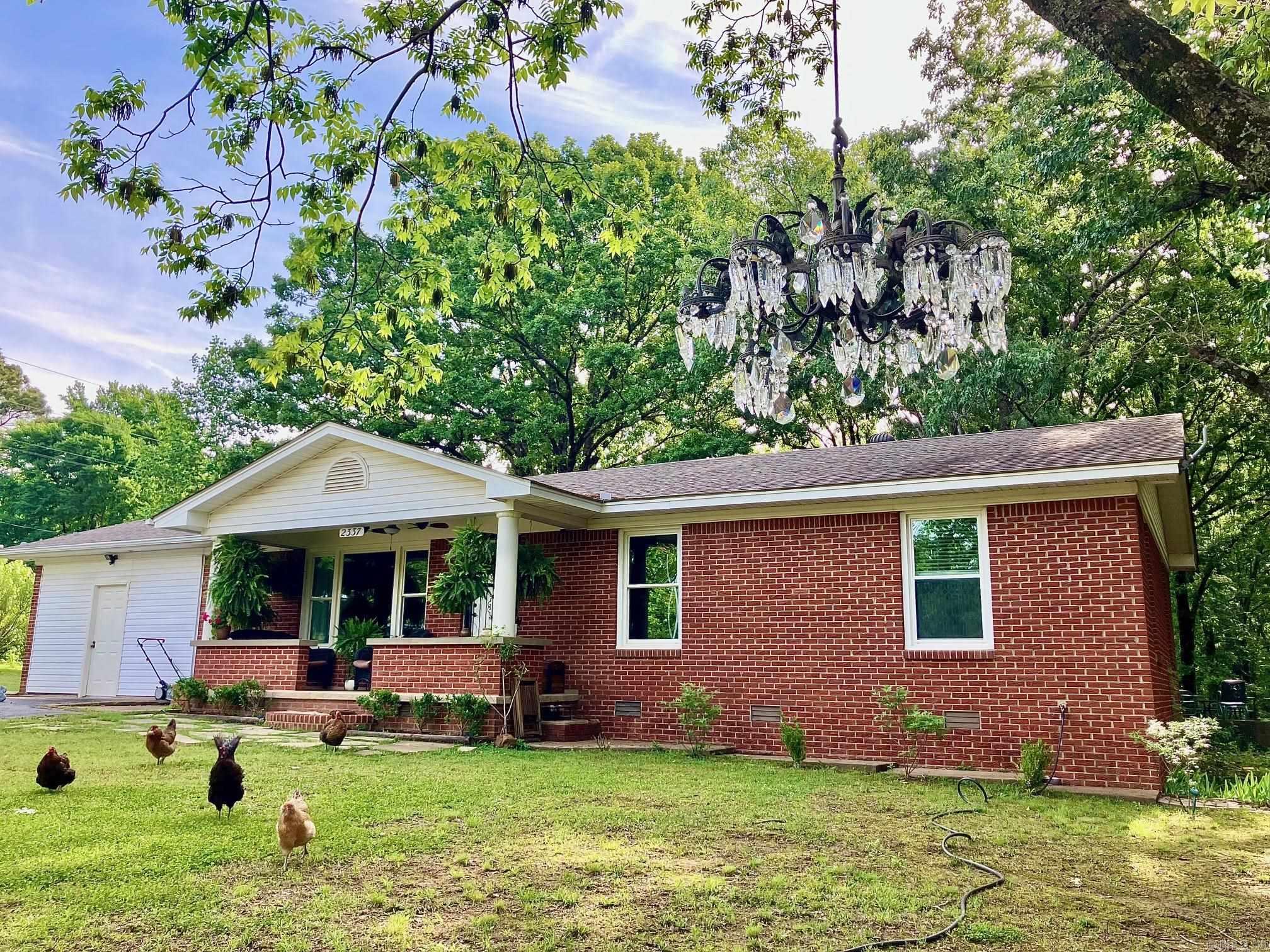 Two homes both completely renovated. See the before and now pics for the year long transformation. 2.68 +/- acres of beautiful forest & the perfect home for anyone wanting a "homestead" or "hobby farm" lifestyle without the work. The main house welcomes you with warmth & character. Just steps away, an enchanted cottage rests like a hidden gem, perfect for guests, or extra income with it’s own septic, split unit, kitchen, full bathroom, bedroom & den. Both homes are designer finished & close enough to town for modern conveniences. Come see for yourself. Warning: you might fall in love. Oh and there’s a lake about 5 minutes walking down the road. So bring your fishing poles.