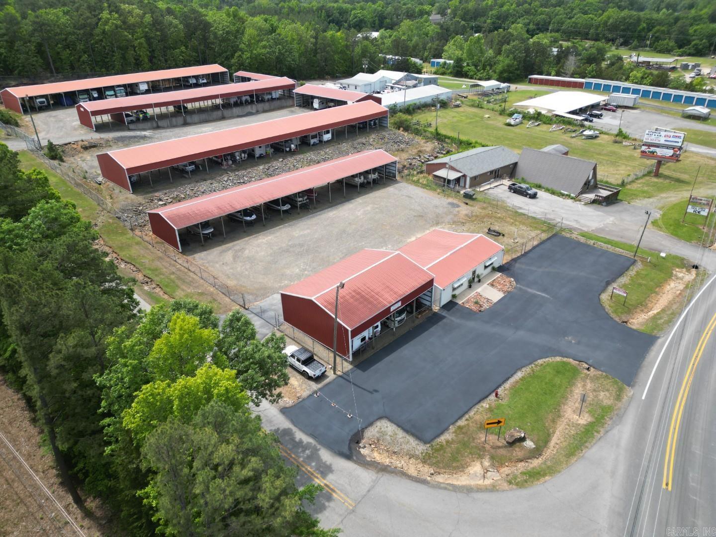 Excellent investment opportunity in Heber Springs. This 81-unit storage facility is ideal for boats, RVs, and travel trailers, offering income potential. Conveniently located near Dam Site Marina and the Heber Springs Airport, this property is perfectly positioned for lake visitors, vacation homeowners, and outdoor enthusiasts. The property also includes an office building, providing space for management, rentals, or additional business operations. Easy access, great visibility, and close proximity to some of the area's most popular boating and recreation destinations. Whether you're looking to expand your investment portfolio or own a storage business near the lake, this property offers endless potential.
