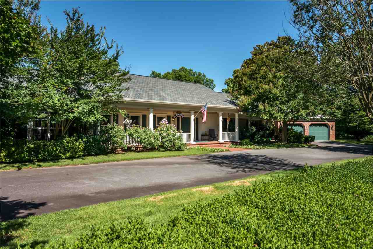 Gorgeous estate on 12.5 acres near Two Rivers Park. Separate living spaces (15,000 sq feet total) connected by covered brick walkway for outdoor flow. Trophy House (6559 sq ft) boasts bedroom suite w/ balcony & grand entertainment hall w/ stone floors. Original house (4261 sq ft) has 4 bedrooms & 3.5 baths. Guest House (3293 sq ft) w/ 4 bedrooms, 2 baths overlooks pool & magnificent English garden by P. Allen Smith. Horse barn. Playhouse. Wine cellar, elevator. Caretaker apt., garages for 12 cars, and more!