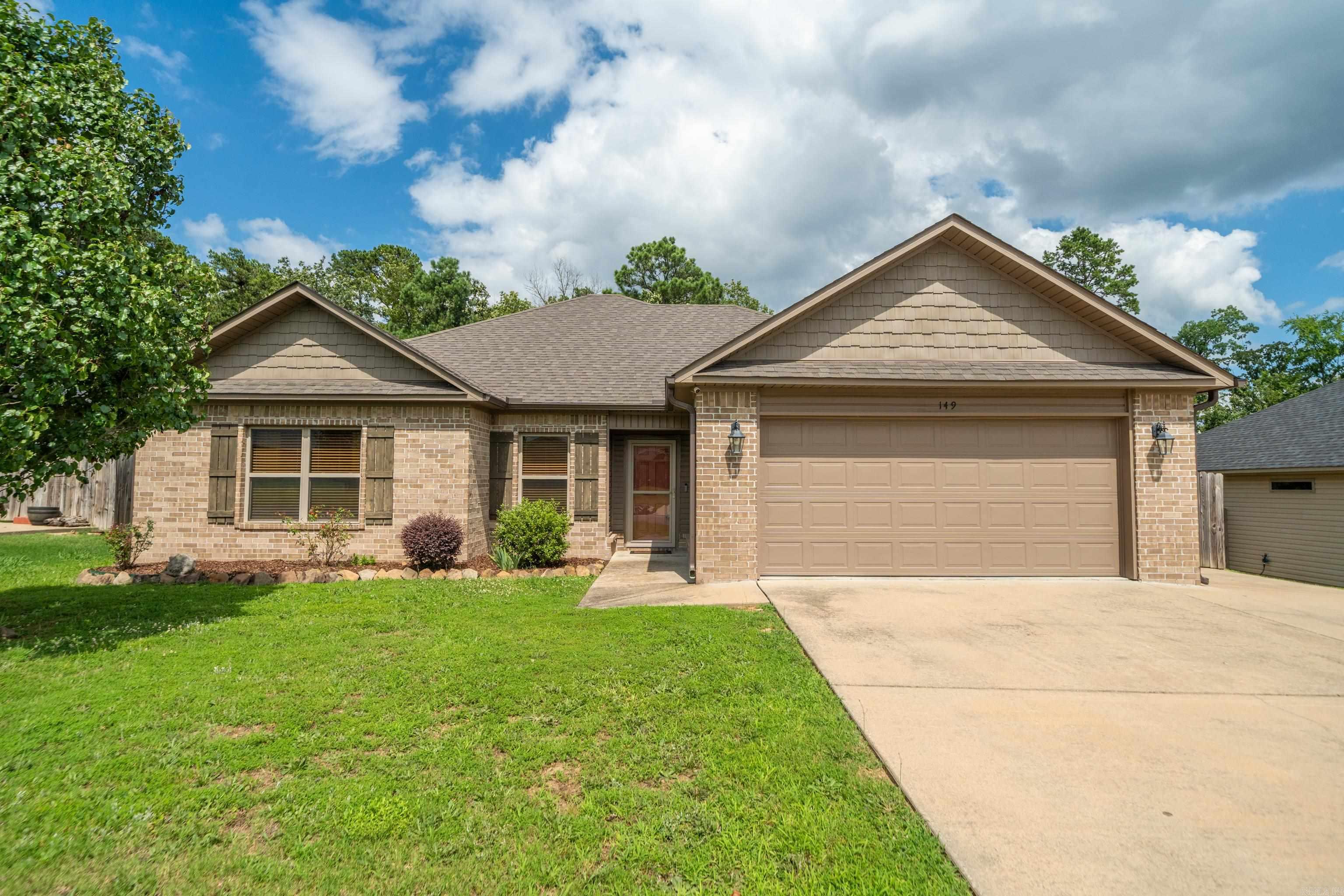 Your Family will Love calling 149 Cambridge Drive "Home"... featuring 11' Ceilings and Beautiful LVP Flooring in the Living Room, a Spacious Dining Area with Extra Room for a 2nd Sitting Area or Book Nook! The Kitchen is equipped with Natural Wood Cabinetry, Granite Counters, a Double Oven and Walk-in Pantry! Enjoy a Split Floor Plan and Great Storage! This Home Lives Well and the Screened in Porch overlooking the Fenced Back Yard and Woods Beyond is Everyone's Favorite! In Addition to the 2 Car Garage, the Driveway is Oversized with additional Parking! Storage Building Coveys. New HVAC. The Roof and Siding is 2 years old. Call your Favorite Realtor for a Tour!