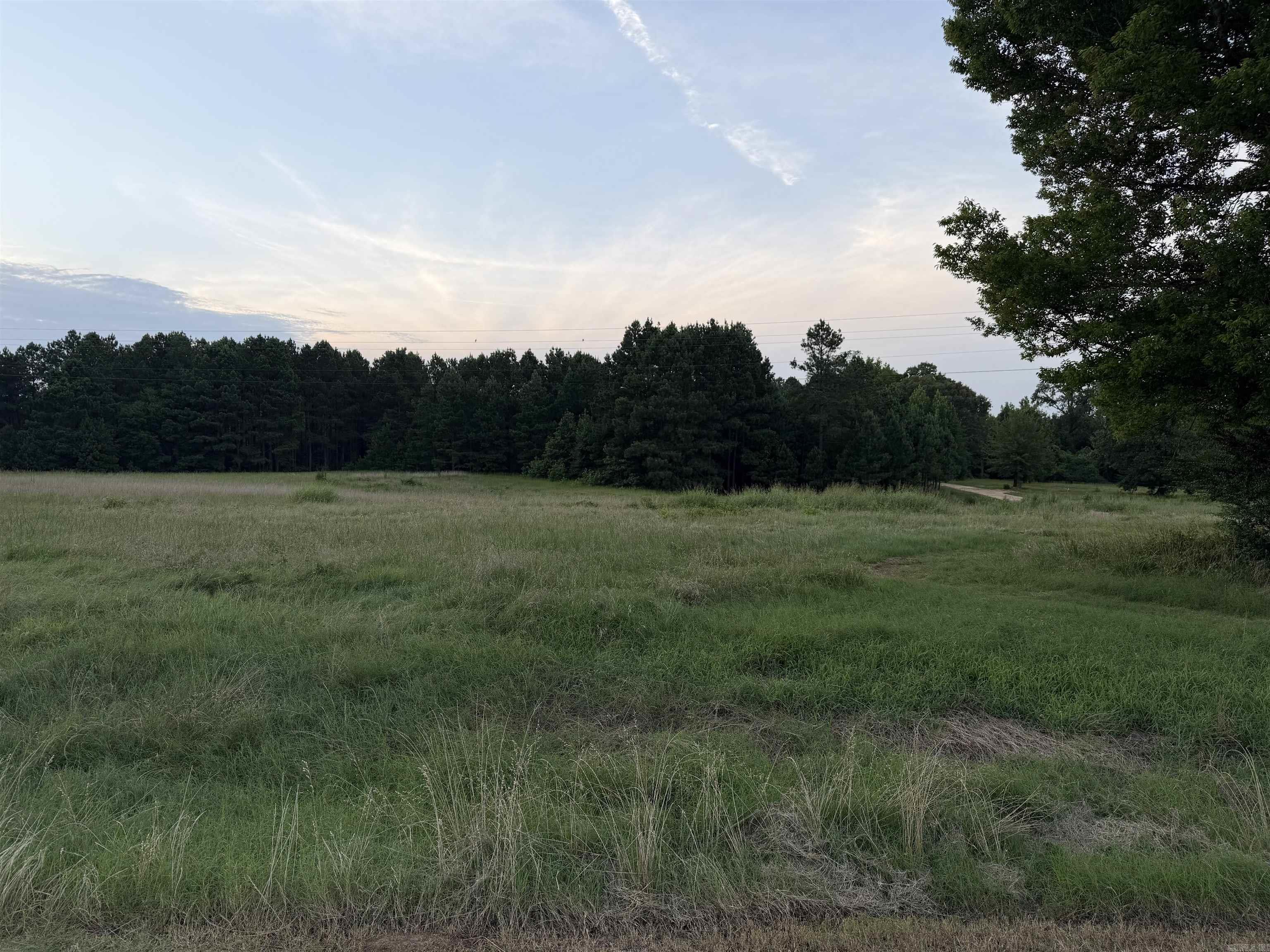 Looking for land just outside of Sheridan to build your new dream home? Look no further. This land consists of three parcels that contain a total of just under 25 acres. There is a cleared plot of the land with highway frontage that is level and ready to build. Let's go check it out today.