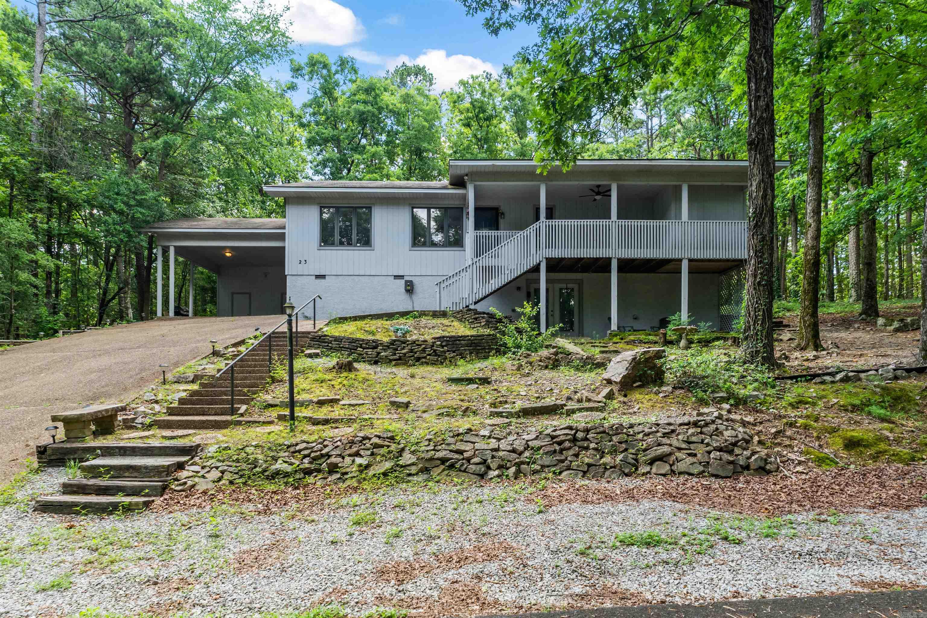 Location doesn't get much better than this. Situated in the west side of Hot Springs Village, 23 San Clemente Circle puts you minutes from DeSoto Golf Club, close to the shores of several of HSV's 11 pristine lakes, and just a short drive from the stunning waters of Lake Ouachita.   This completely renovated home sits tucked among mature trees with green space on two sides — private, quiet, and surrounded by nature without sacrificing space. Inside you'll find granite countertops, new appliances, and LVP flooring throughout. The floor plan is generous — plenty of room to spread out, entertain, or grow into. Downstairs, a dedicated workshop and craft area adds versatility you'll wonder how you lived without.   If you've been looking for a move-in ready home in an established neighborhood with room to breathe, this one checks every box.