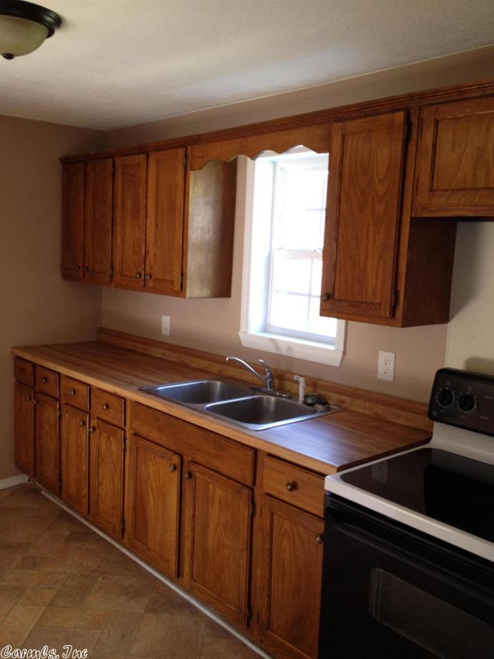 Come see this Cute house on a double corner lot.This home has been completely remodeled ,inside and out.New double pane windows,flooring,paint & light fixtures.All appliances convey including washer & dryer.Roof is only about 5 years old. Water heater 2 yrs old.Call today to see this cute home in a nice neighborhood.
