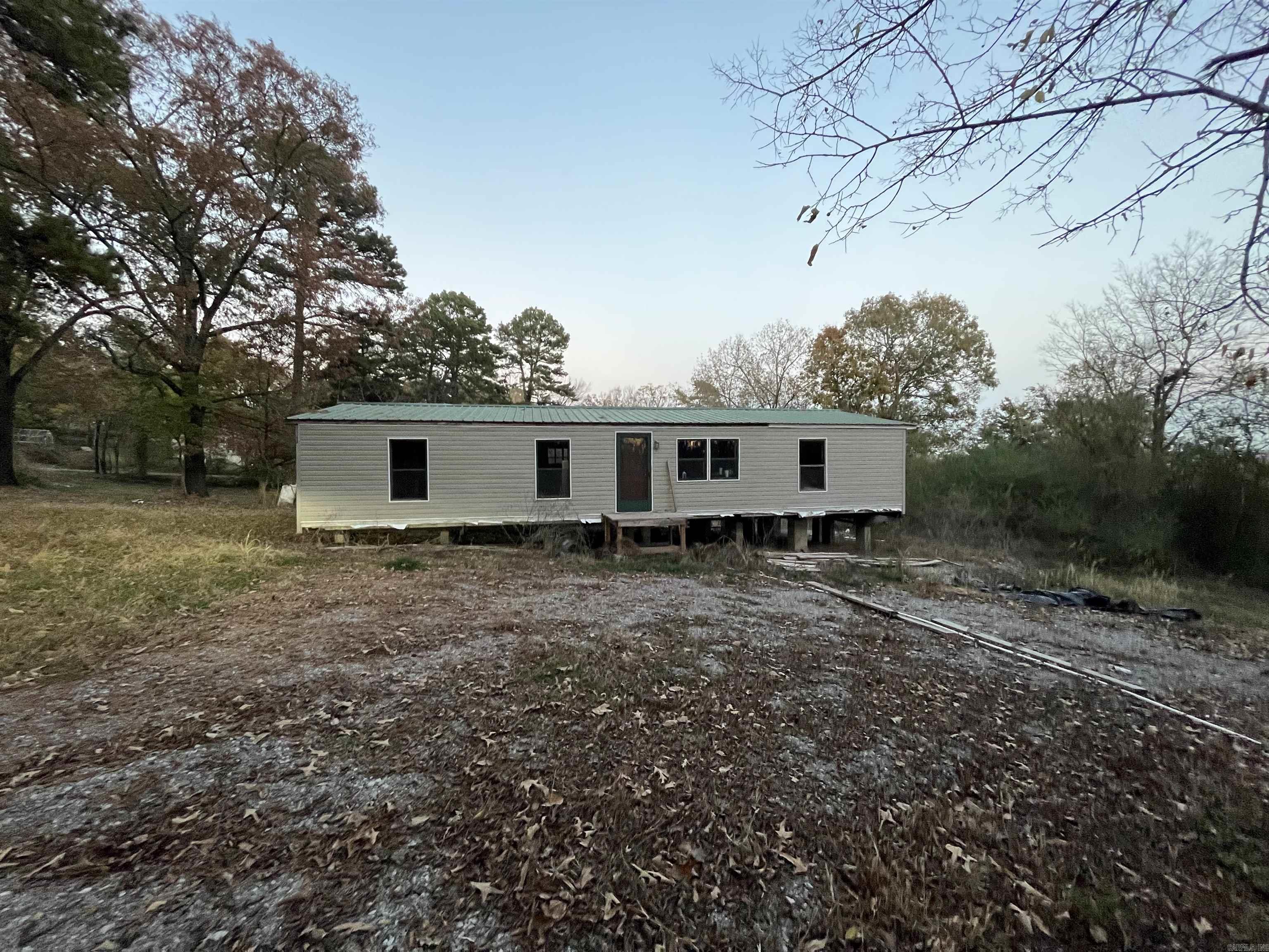 ?? New Listing: Unfinished Mobile Home on 3.68 Acres – A Blank Canvas Awaits! Seize the opportunity to create your dream home on this expansive 3.68-acre property, featuring an unfinished mobile home ready for your finishing touches. Located less than 5 miles from the center of town, this land offers the perfect balance of country living & city convenience. The property boasts a new metered pole, ensuring that your electrical needs are catered to from the get-go. The land has been cleared, presenting a blank canvas for landscaping or agricultural projects, and a new gravel driveway has been laid, setting the stage for a welcoming entrance to your mobile home comes with new PEX plumbing throughout, providing a reliable and durable plumbing system. A septic system is already in place, taking a significant item off your to-do list. Imagine the possibilities as you design your living space exactly how you want it. This property is ideal for those looking to put their personal stamp on their home and land. Do miss out on this unique chance to craft your own homestead just a stone's throw away from town amenities. Contact us to find out more and to schedule a visit to your future home.