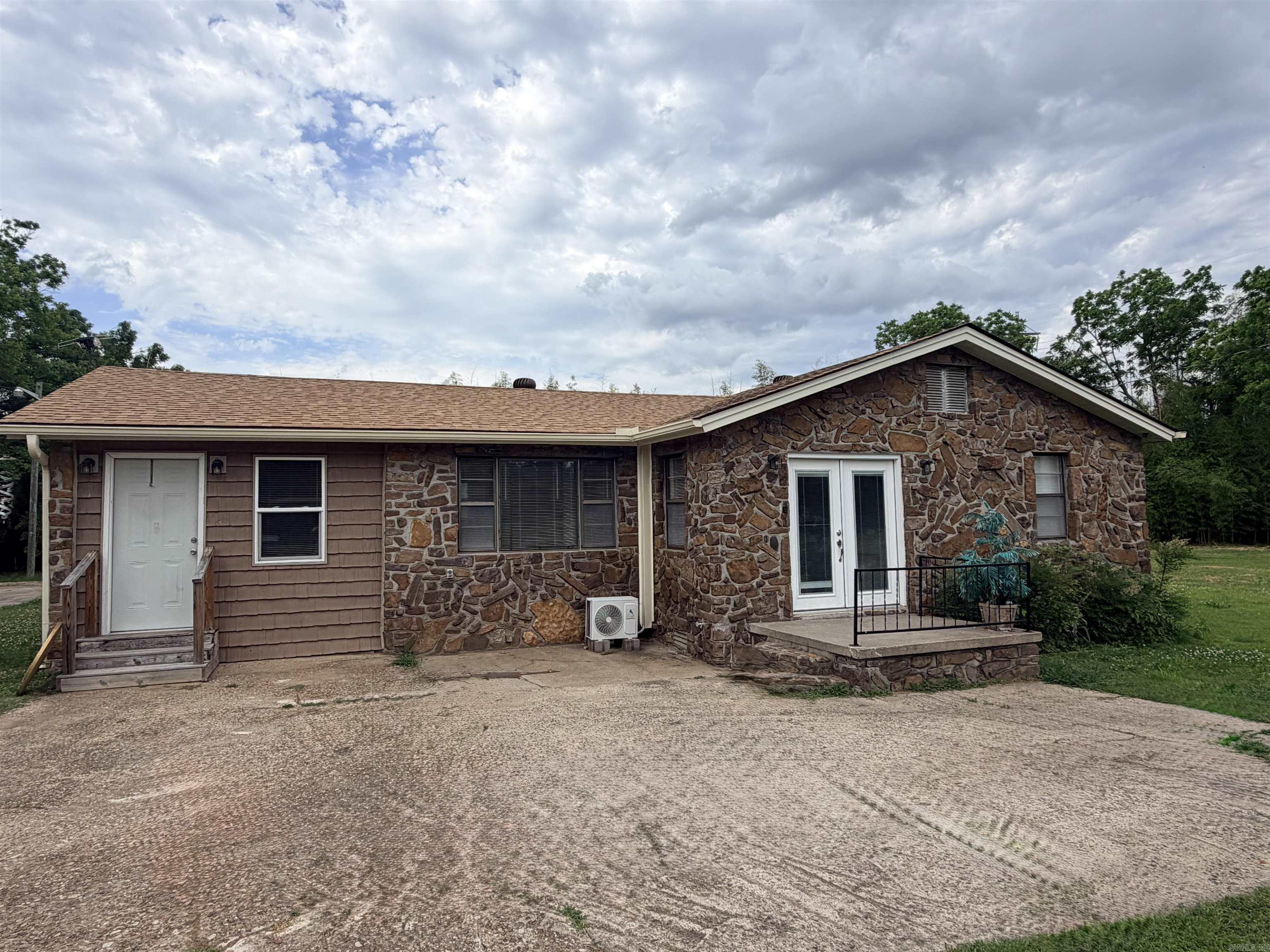 Welcome to 1604 West Childress where you can own for less than you can rent!  This well kept rock house is move in ready and has had a ton of renovations done in the past few years!  Extremely efficient with mini split high efficiency Ac and heat units installed.  Garage has been converted into game room or second living area with washer and dryer hookups in laundry room.  Electrical has been updated as well as architectural roof installed just a few years ago.  Beautiful original hardwoods in bedrooms and laminate flooring throughout the remainder of the house. Level lot with storage shed in back yard for extra storage space. Located just 5 minutes from down town Morrilton and minutes from the interstate.  Call your agent and check this one out to make this home!