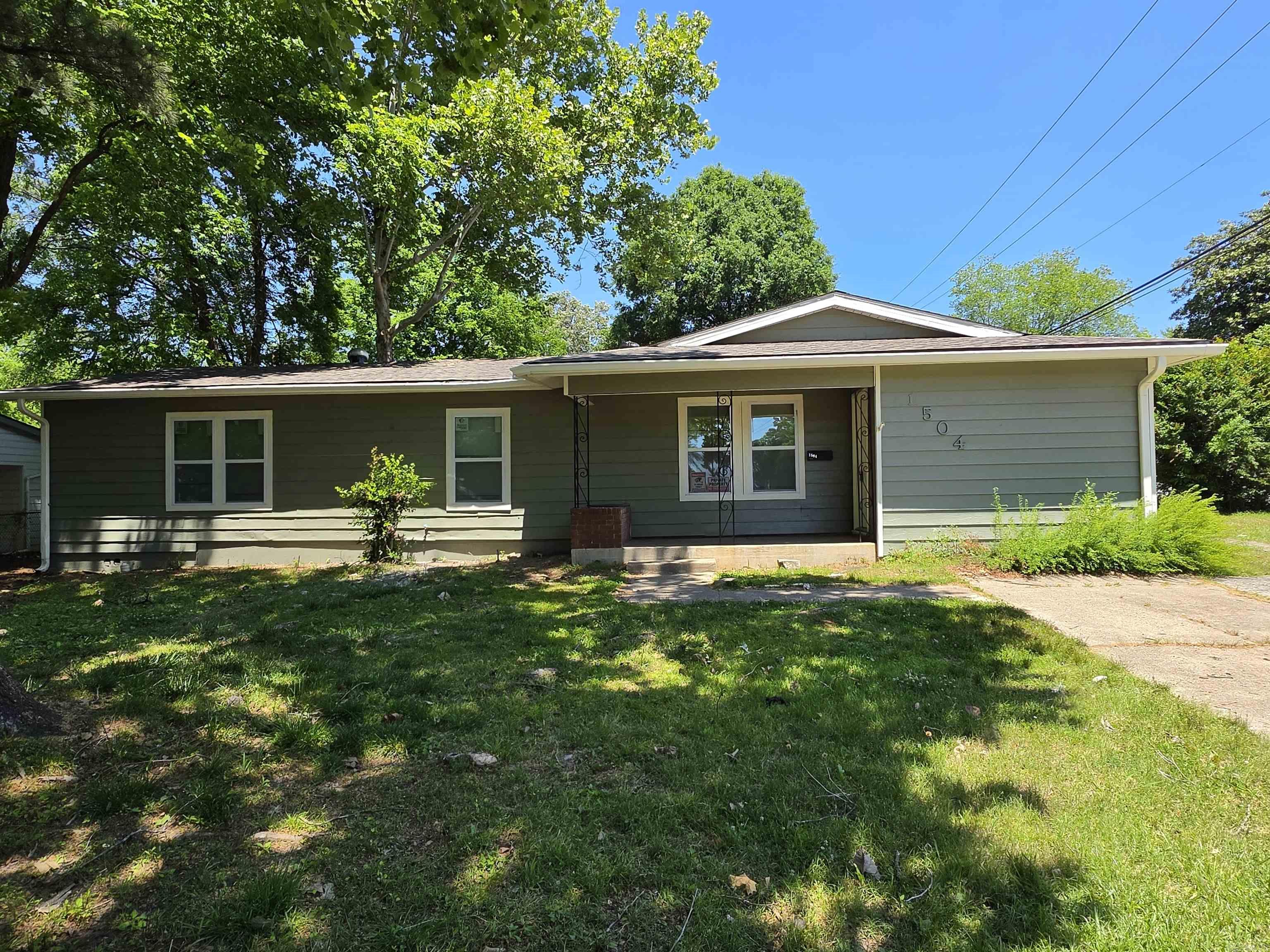 This stunning, fully renovated single-family home offers modern comfort and timeless charm. Featuring 3 spacious bedrooms and 2 beautifully updated bathrooms, it’s move-in ready and perfectly maintained. Step inside to find luxury vinyl plank flooring throughout the entire home for a clean, durable, and stylish look. The kitchen shines with exquisite tile work, high-end finishes, and an inviting layout perfect for cooking and entertaining. Both bathrooms boast the same high-quality tile craftsmanship and contemporary fixtures. Relax in the cozy second living room anchored by a warm wood-burning fireplace ideal for chilly evenings. The home is all-electric, energy-efficient, and low-maintenance. Outside, enjoy a large corner lot with plenty of space for outdoor living, gardening, or future expansion. You’ll love the convenience of fast interstate access and being just minutes from shopping, dining, and everyday essentials.