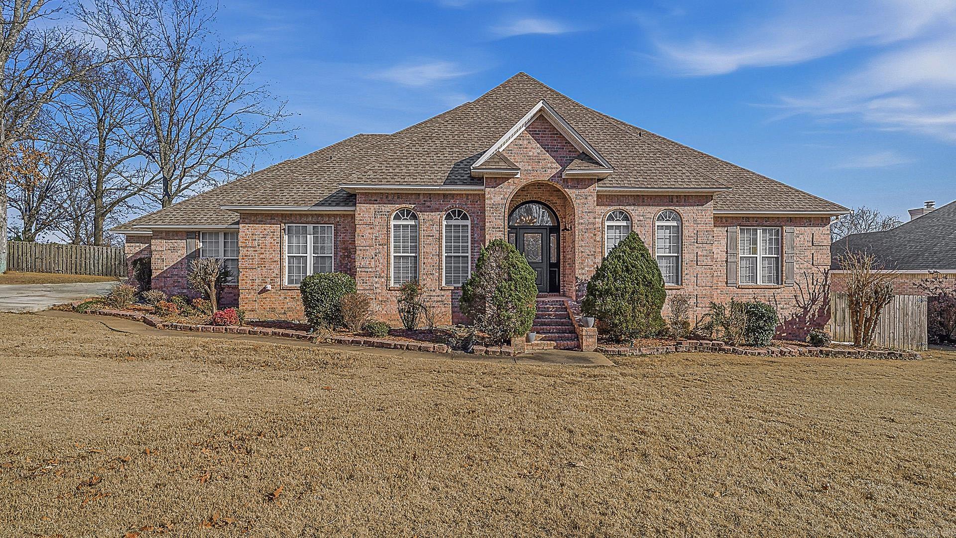 Welcome to 3916 Brandywine Dr., Jonesboro, AR, located in the established Rossland Hills neighborhood. This spacious home offers 6 bedrooms, 5 full baths, and 2 half baths, priced at $599,900. Features include a grand entry, formal living room, and an extra-large great room with vaulted ceilings and a gas log brick fireplace. The main level includes 3 bedrooms plus a private bedroom with its own full bath, ideal for guests, in-laws, or teen suite. Off the great room are a theater room, wet bar area, and a nearly 300 sq ft all-season room built in 2024 with epoxy flooring and its own split HVAC system (not included in listed square footage).  The 1,440 sq ft walk-out basement includes two bedrooms, a Jack-and-Jill bath, half bath, and ample storage, with sidewalk and ramp access—ideal for guests or extended living. Exterior features include a large driveway, covered outdoor area, wood privacy fence, portable storage shed, and manageable backyard. Neutral interior colors throughout. Walkable in-town location close to shopping, dining, and medical offices. Inside city limits with CWL utilities, city water, and no septic system.