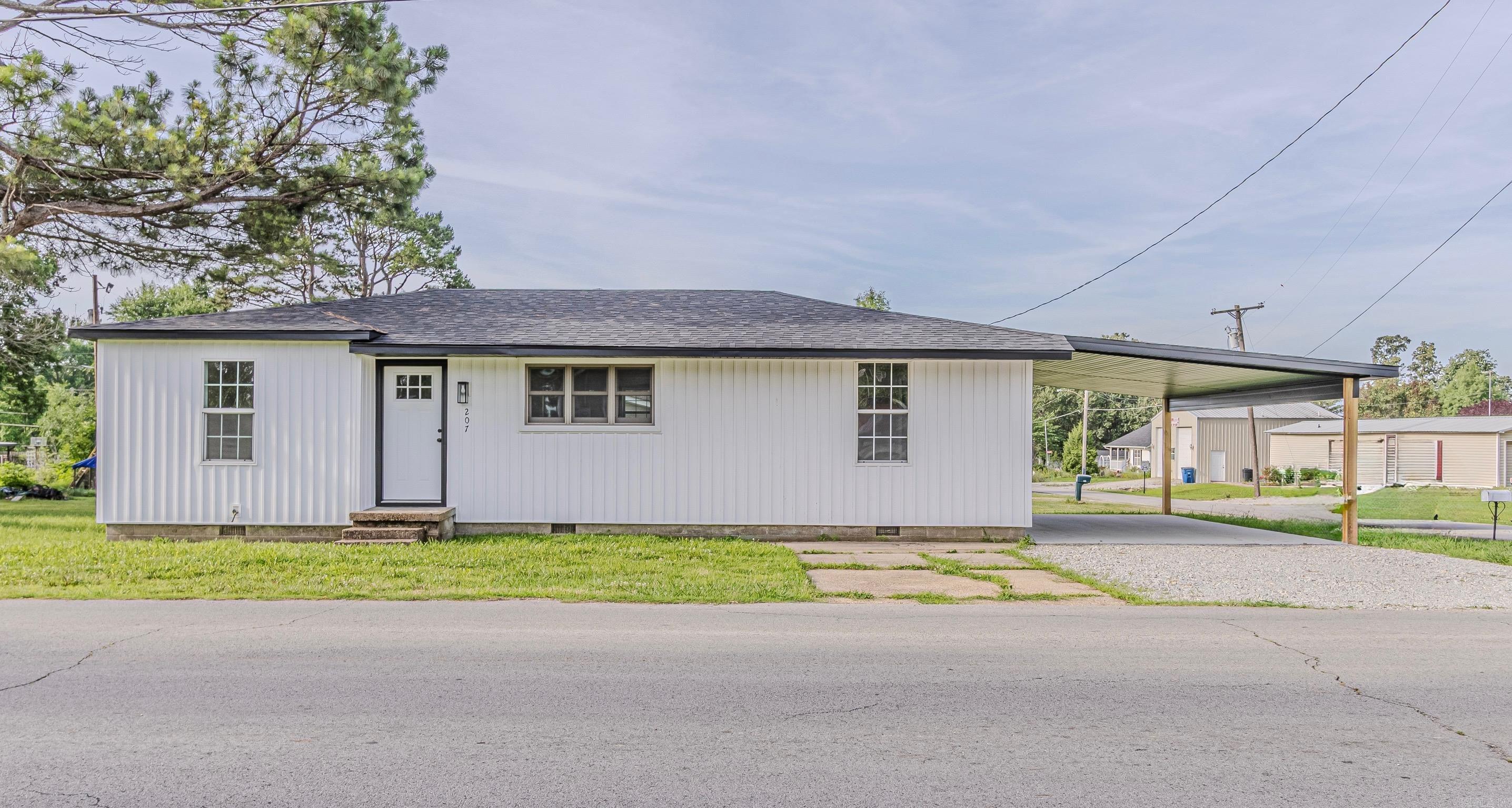 She’s not just renovated… she’s had a complete glow-up. Completely upgraded and move-in ready, this 3-bedroom, 2-bath home sits on a spacious corner lot and has been thoughtfully updated from top to bottom. The floor plan was redesigned to create a more open layout, including a new primary bathroom and relocated laundry area. Major improvements include leveled floor joists, updated subflooring, new sheetrock, paint, flooring, lighting, cabinetry, and updated plumbing and electrical where needed. The kitchen features new cabinets, butcher block countertops, and stainless steel appliances, while both bathrooms have been refreshed with new shower units and fixtures. Outside, you'll find brand-new Hardie board siding, a new roof, new interior and exterior doors, and a newly constructed carport. With the big-ticket items already completed and modern finishes throughout, this home offers the perfect combination of style, function, and peace of mind. Just move in and enjoy.