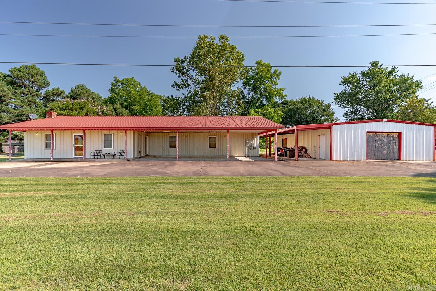 Welcome to the market 333 White Drive in Cherry Valley, Arkansas! Spacious 2 bed, 2 bath home on a 0.34-acre corner lot with over 2,150 sq ft of living space. Features a massive 40x50 insulated metal shop, 3-car carport, and metal roof over low-maintenance siding. Enjoy a huge kitchen with abundant counter space, large living room, and a wood-burning stove for efficient heating. Tile floors, spray foam insulation, and slab foundation offer durability and energy savings. Separate dining, built-in appliances, washer/dryer connections, and unfinished space provide daily convenience and room to grow. Located outside city limits with paved road access and municipal utilities. Call today to book an appointment! Every man is waiting for this shop!