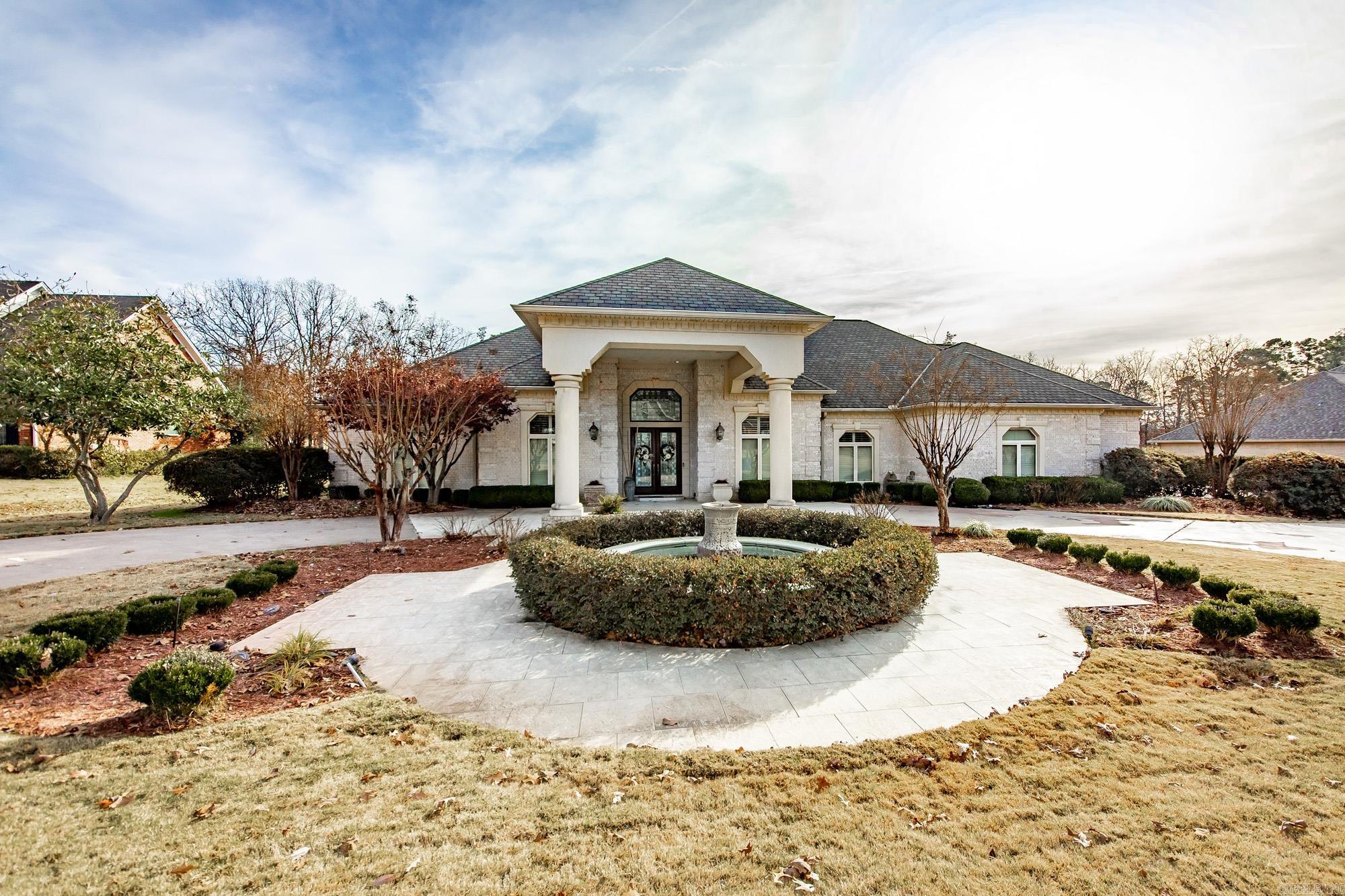 Experience luxury living on the 18th fairway of Greystone Country Club!  This custom estate offers every amenity imaginable with an open floor plan overlooking the pool, hot tub, outdoor kitchen, and pristine fairway views!  Step through a grand entryway accented by beautiful columns, elegant living area, and an adjoining spacious office.  The gourmet kitchen features elegant finishes and is perfect for everyday life or entertaining.  All bedrooms include an en-suite bath, ensuring comfort and privacy throughout the home.  The primary suite is oversized with dual custom closets with islands, and a spa-inspired bathroom complete with heated floors.  An upstairs bonus/game room is truly one of a kind!  This home also features a 4 car garage with an additional golf cart parking.