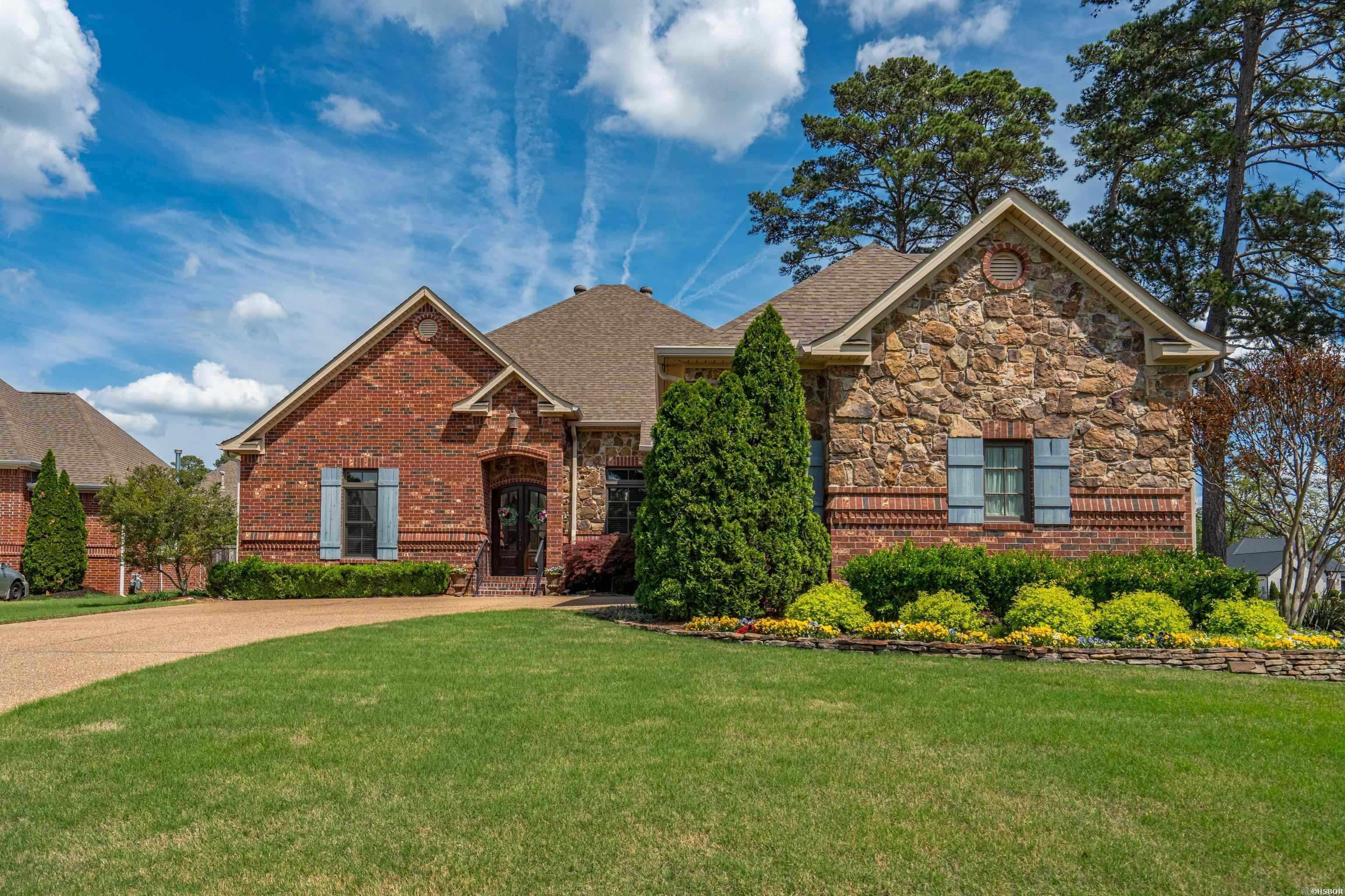 This upscale home offers a warm welcome from the moment you arrive. Beautifully maintained, the 4-bedroom, 3-bath layout features an open-concept design ideal for everyday living and entertaining. The inviting living area showcases wood floors, 12-foot ceilings, and a cozy fireplace. At the center of the home, the kitchen features a large island with breakfast bar seating, custom cabinetry, and abundant storage. Both formal and casual dining spaces provide flexibility for any occasion. Upstairs, a bonus room offers versatile space for a media room, fitness area, or guest retreat. The fourth bedroom is currently used as a home office, adding functionality. Step outside to a covered patio and landscaped yard with additional seating—perfect for relaxing or hosting. A three-car garage offers ample storage. Located in a gated community just minutes from top-rated schools, shopping, and medical facilities, with private access to Hot Springs Country Club and optional membership.