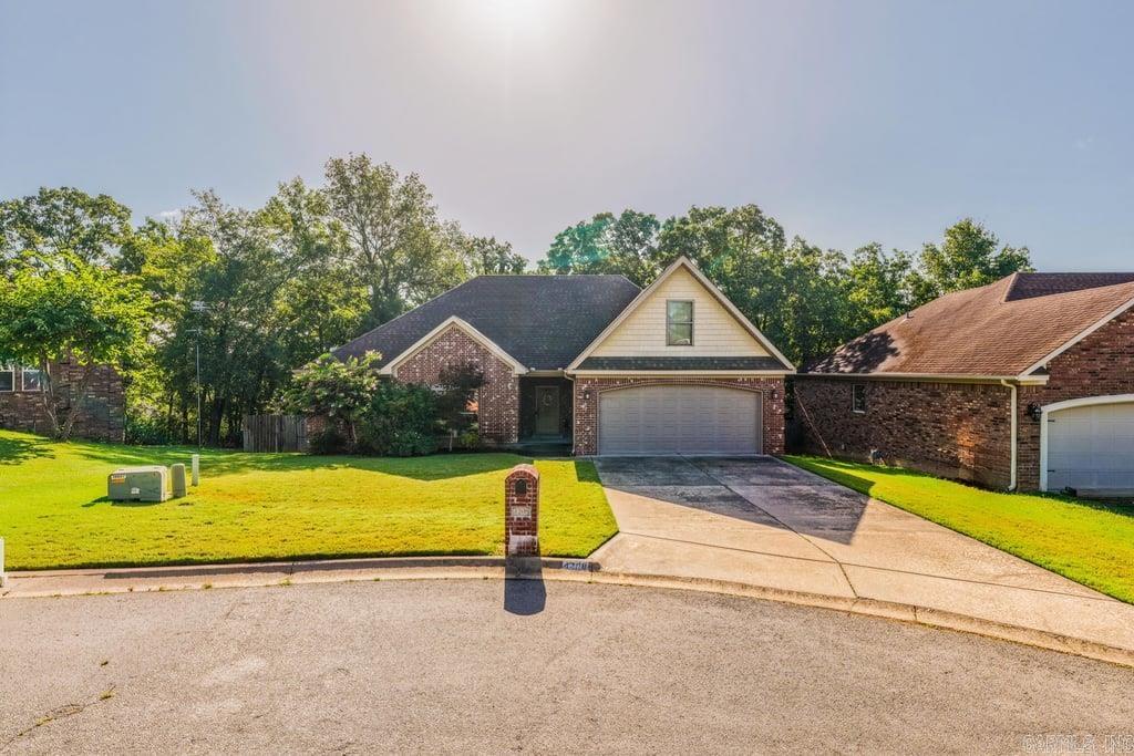 Welcome home to this beautiful 3-bedroom, 2-bath home tucked away at the end of a quiet cul-de-sac in the heart of Sherwood. Built in 2015, this home offers an open, inviting floor plan that's perfect for both everyday living and entertaining.  The spacious great room features a cozy wood-burning fireplace with a gas starter, along with custom built-in cabinetry for your TV and entertainment needs. The kitchen is thoughtfully designed with a beautiful built-in desk area, making it easy to stay organized while keeping the heart of the home functional and inviting.  The oversized primary suite is a relaxing retreat with a luxurious bath that includes a jetted tub, walk-in shower, double vanities, and plenty of space to unwind.  One of the home's hidden gems is the walk-up attic, conveniently accessed from inside the house. It's already an incredible storage space, but it also offers the potential to be finished into a bonus room, home office, media room, or even a fourth bedroom.  If you've been looking for a newer home with charm, thoughtful features, and room to grow, this Sherwood gem is one you won't want to miss! See Agent Remarks!