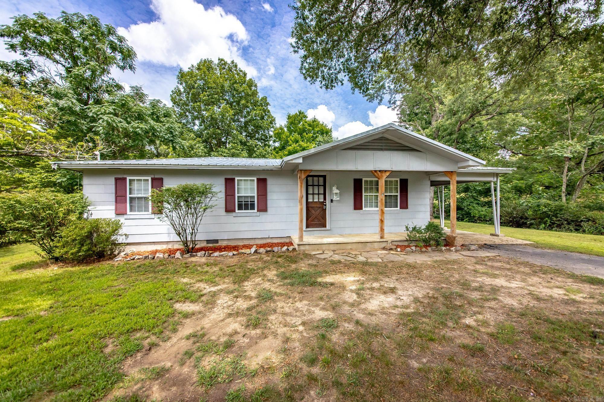 Beautiful Rustic home with acreage right outside of Hot Springs city limits!   You can stop scrolling now because you've found the ONE! 3 bed 1 bath with 6 absolutely beautiful acres, fenced in with rolling hills for your animals and family to thrive. The home? Totally remodeled from the floors to the fixtures to the walls. All major appliances are new and included. You'll love the huge wood stove and shining exposed ceiling beams. The land? A spring fed pond sits in the back corner, a barn sits in the middle, and fruit trees are sprinkled throughout. The address?- your next one- 774 Fleetwood Drive  Agents see remarks please
