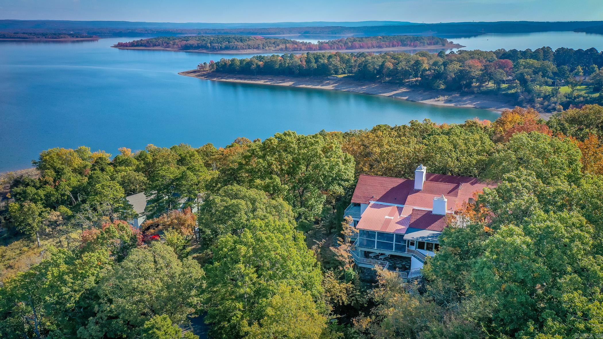 You will love this charming home in Eden Isle just minutes from Red Apple Inn and Greers Ferry Lake!! Built by the original developer of Eden Isle, this unique property has beautiful scenic views from every angle. The floor plan encompasses 4 roomy bedrooms, 4 bathrooms giving you over 7,000sf of spacious elegance! The generously proportioned interior flows effortlessly from the open-plan living space to the multiple private patios perfect for family gatherings! NEW HVACS and home comes fully furnished. All of this situated in a convenient, friendly neighborhood. Call today to see this lovely property!