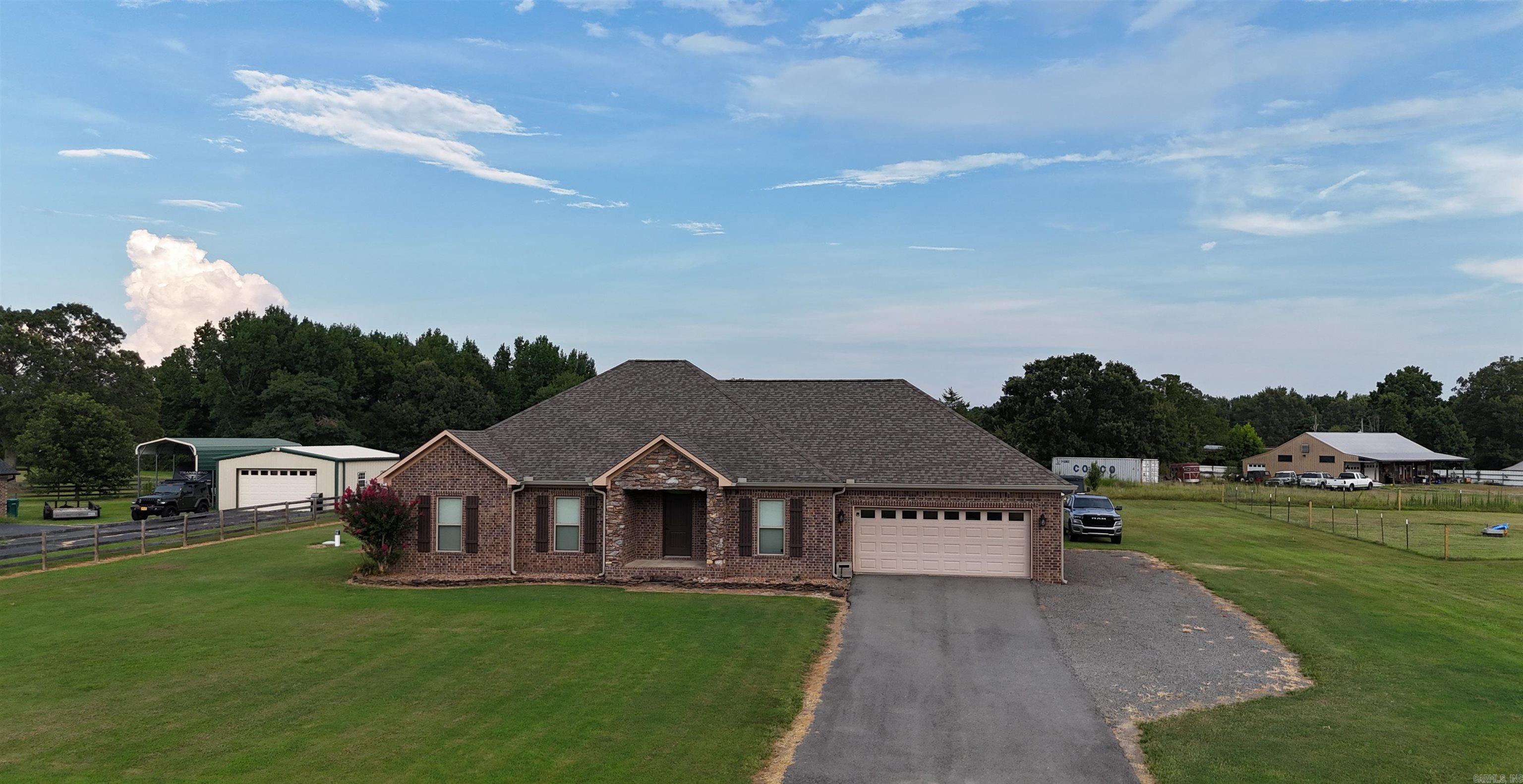 RURAL LIVING AT ITS FINEST!! Check out this gorgeous 4BR/2BA home that sits on a level 1 acre lot. This home has so much to offer, from the wooden beams in the living room, to a spacious master, concrete floors and a kitchen that is perfect for entertaining and being around the family. This home even has a new storm shelter for those stormy nights. If you are looking for country living but still close to the amenities of the city, this is the ONE! Call today!!!