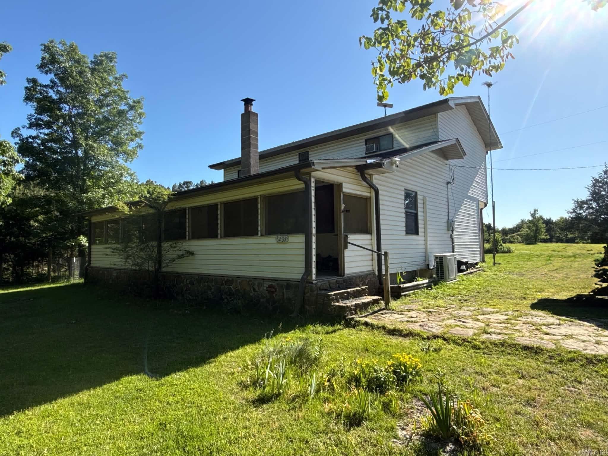 Situated on 12.5 acres just outside Mountain View, this 3-bedroom, 2-bath home offers a private setting with a mix of wooded and open land. Located along the boundary of Mountain View and Rural Special school districts, it provides added flexibility for buyers.  The home is 2000 sq ft with a great two-story layout, with the main living area, kitchen and one bedroom on the main level and the other bedrooms located upstairs.  Recent improvements include a new roof (Dec 2025), updated kitchen and downstairs bath, new flooring and subfloors, updated lighting and doors, and foundation work. The home includes a mini-split system (2024) along with propane heat.  Additional features include city water, septic, Starlink availability, and a detached 2-car garage.  The acreage includes a seasonal pond and seasonal creek, adding natural character to the property.  The property is very flat with endless opportunities.
