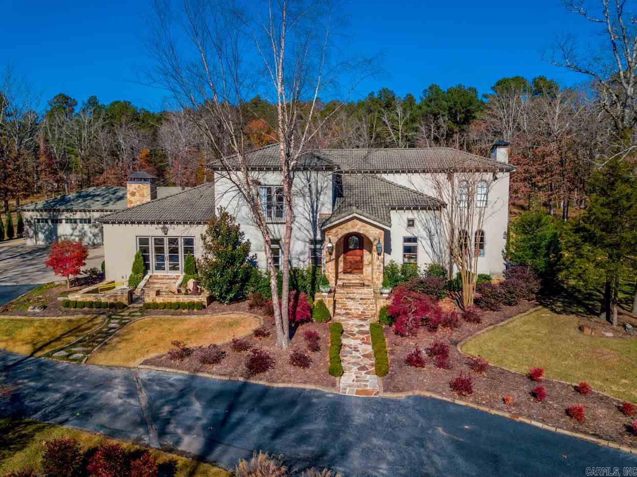 Spectacular home located on gorgeous acreage in gated neighborhood adjacent Yacht Club Marina!  Exquisite design and impeccable construction. This home provides the ultimate setting for fun family living and fabulous entertaining. Handsome entry flanked by elegant formal dining and study.  Gourmet kitchen open to breakfast and den with FP and extensive covered outdoor terrace.  Luxurious spa inspired master suite on the main level.  Large family living rm w/stone FP.  Upstairs: 4 br's 3 ba's. 4 car garage.