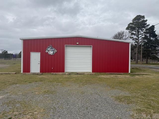 Come check out an extremely nice 2,400 sq. ft. all metal building with a half bath. Water and sewer are hooked into the city system. The interior is completely floored with astro turf. The walls, ceiling and doors are all insulated. There is a drinking fountain inside. There are 2 separate batting cages for batting practice if you so choose. This is probably the cleanest metal building I have ever sold.