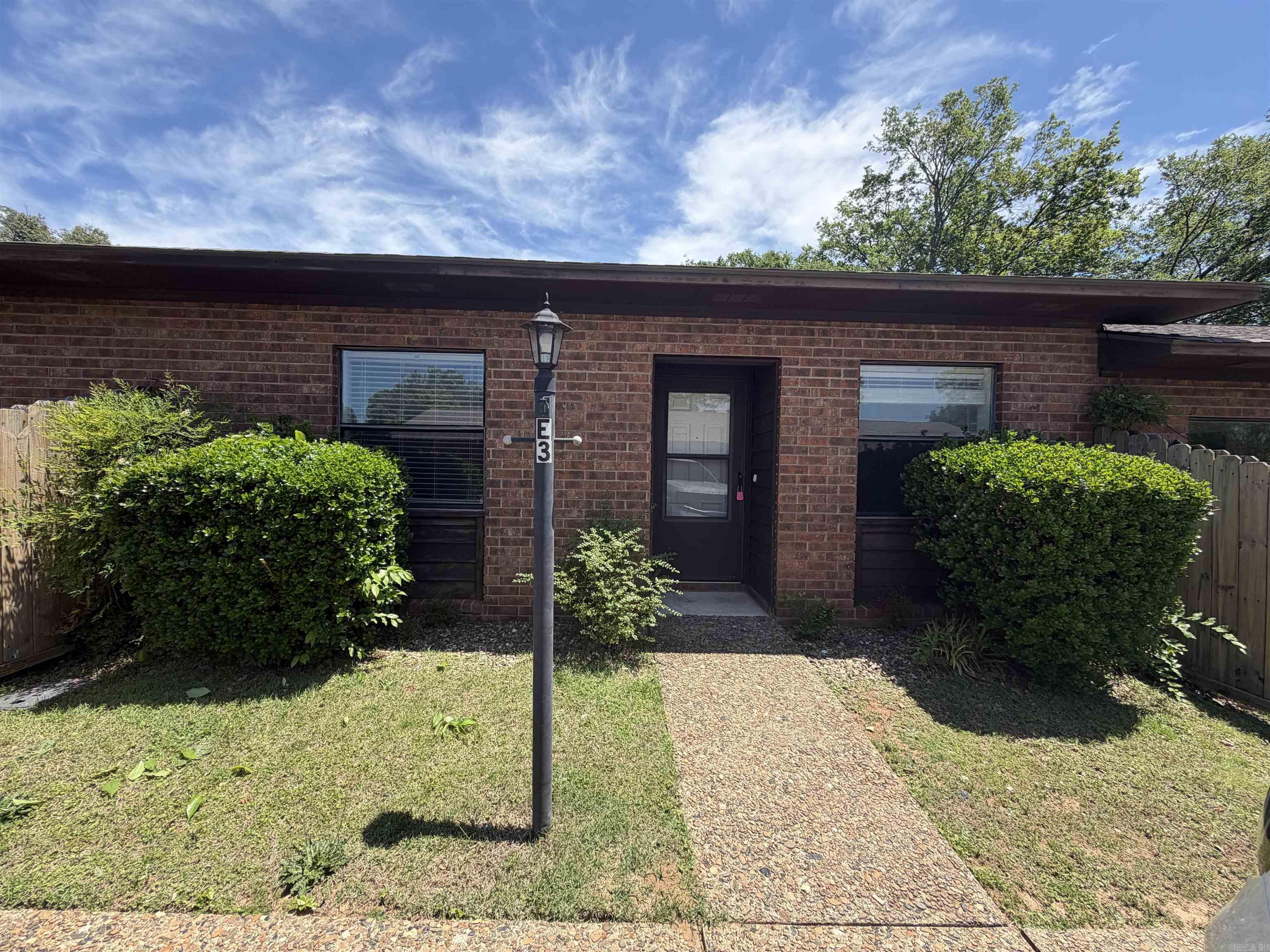 UPDATED 2bed 2bath walk in 1 level all brick condo in super convenient location. NEW paint, LED lights & fans, SS kitchen appliances. Recent flooring updates. Entire complex has a new roof. Quiet area but easy access to Airport Rd & the bypass. Unit comes with stack washer/dryer. Private fenced in outside patio. Super easy living. Big covered pavilion with picnic tables for common use. Swimming pool. HOA fee covers exterior maintenance and grounds so life is easy! Good rental potential. THIS LISTING FOR UNIT E3. YOU CAN ALSO BUY UNIT E2 AND HAVE 2 UNITS SIDE BY SIDE. See agent remarks.