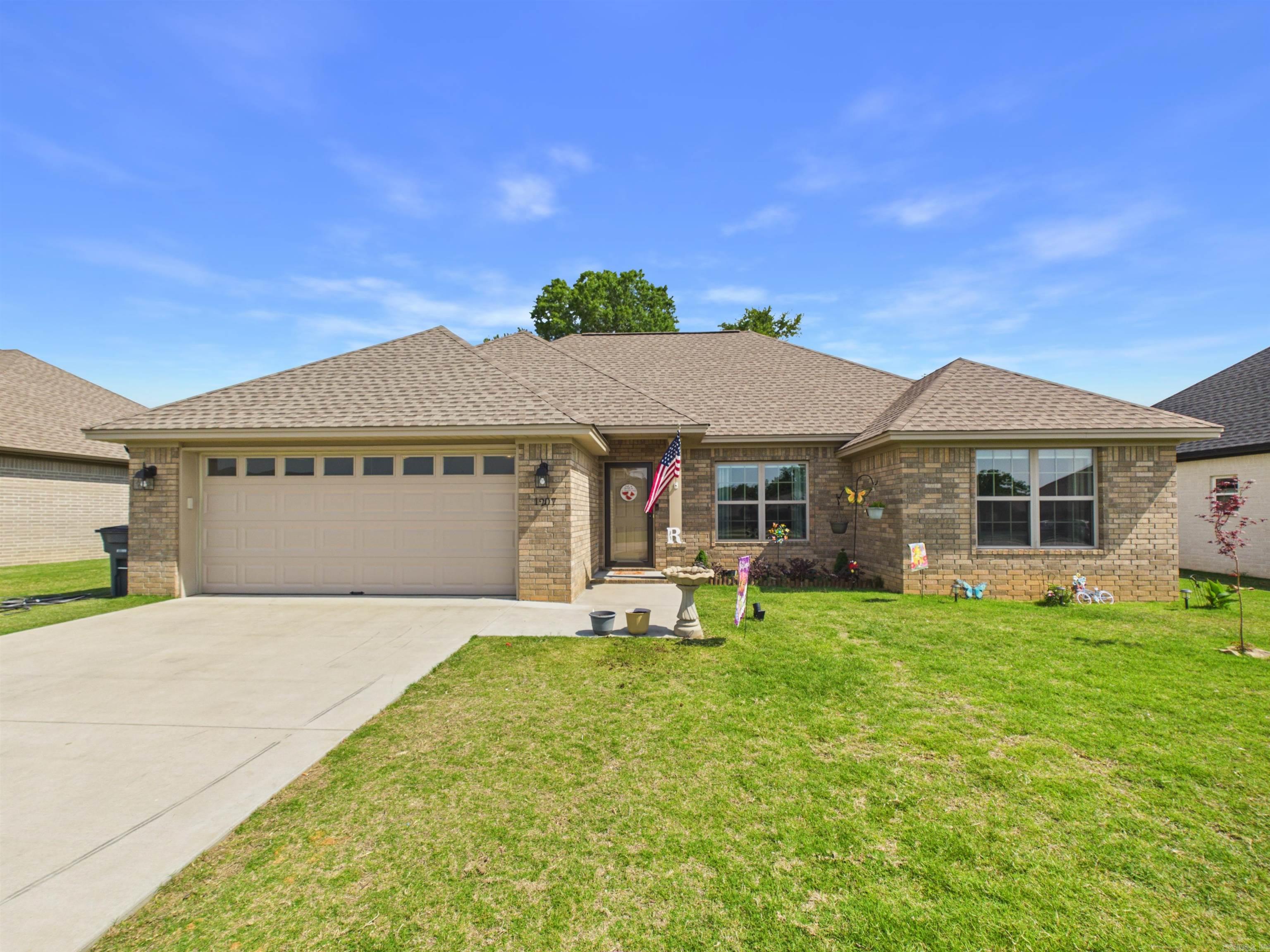 Beautifully maintained and built in 2023, this 3-bedroom, 2-bath home offers 1,467 square feet of modern comfort and thoughtful design. Featuring an inviting split-bedroom floor plan, the spacious primary suite is privately situated on one side of the home, while the guest bedrooms are located on the opposite side for added privacy. Inside, you'll find attractive 9-foot ceilings, charming wainscoting details, and an open, welcoming layout perfect for both everyday living and entertaining. The large primary bedroom includes an en-suite bathroom and oversized walk-in closet, creating a comfortable retreat at the end of the day. Additional features include a separate laundry room and a 2-car garage, providing both convenience and functionality. With its like-new condition and appealing layout, this home is move-in ready and designed to fit a variety of lifestyles.