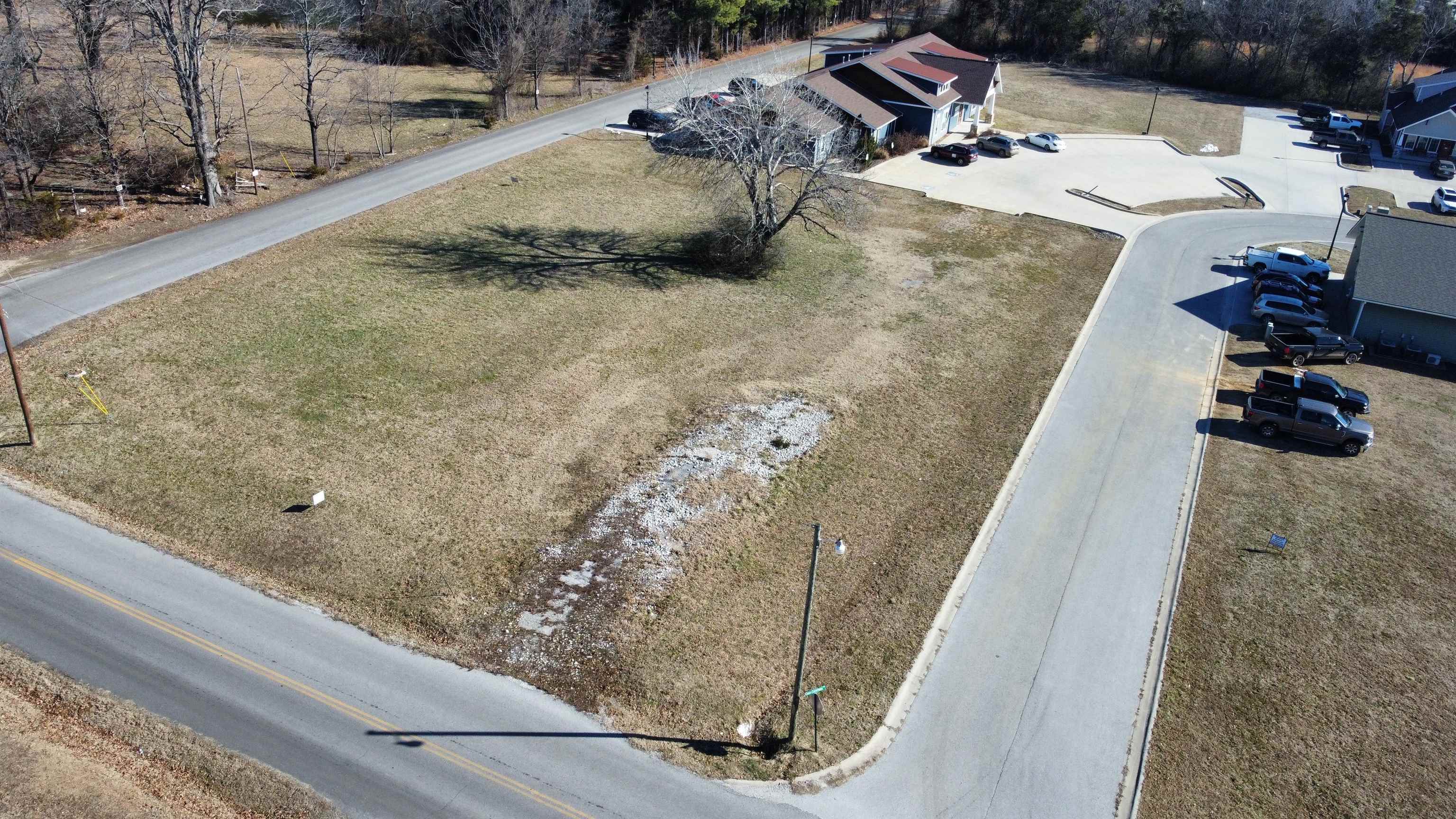 Great commercial lot with high visibility in a bustling commercial park!! There are three very well established businesses with lots of foot traffic and a built in customer base for your business. This lot has paved road access on 3 sides with Case Commons street being on the south side and the road to Mountain View school running along the West and North side so no shortage of access on this one. All utilities are available on site to make the building process as easy as possible. See Plat in pictures for lot lines. Call today and lets go take a look!!