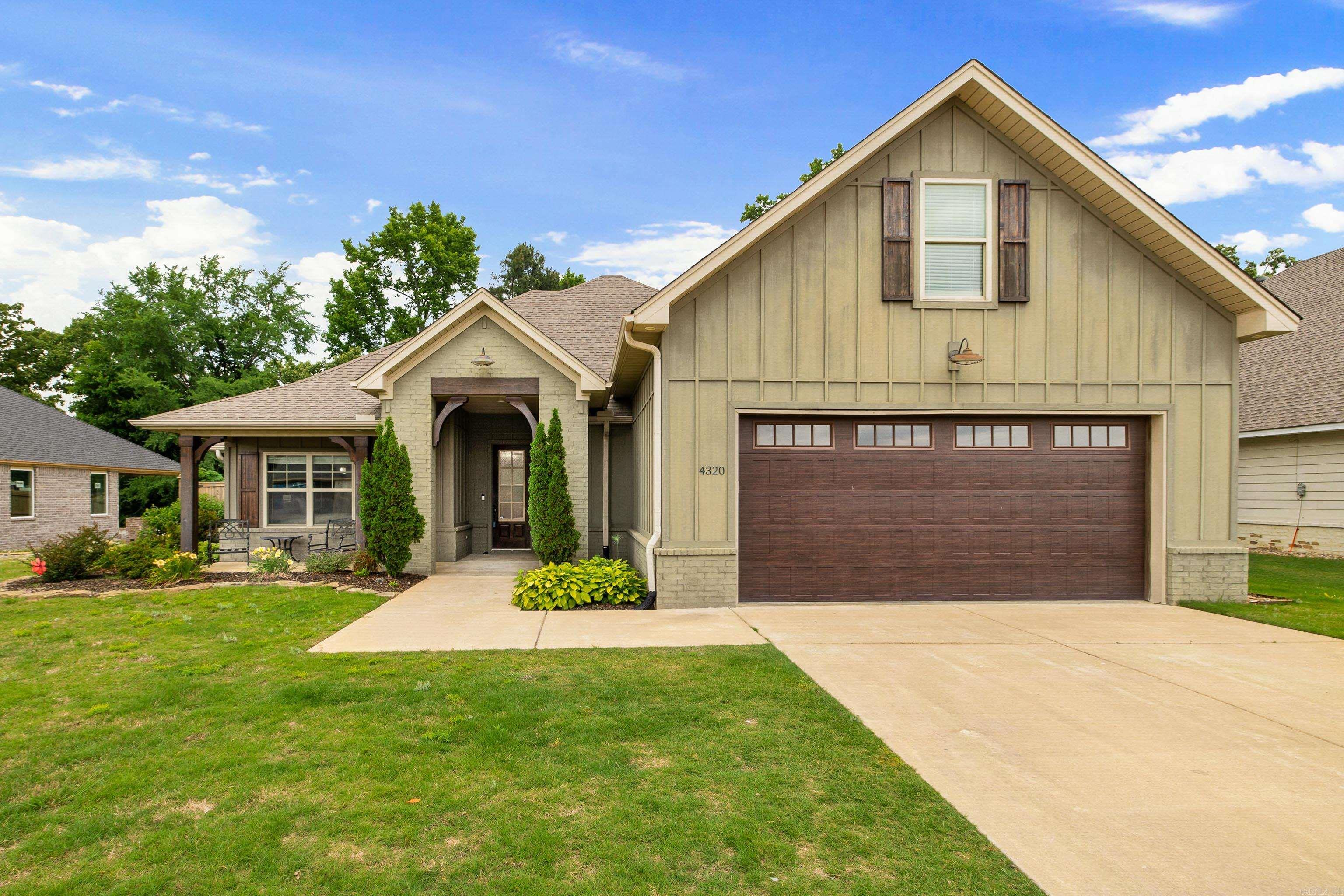 STUNNING HOME WITH NEW FLOORS! The massive covered front porch welcomes you into a foyer that opens to a beautiful living room featuring plate glass windows, a gas fireplace, and custom built-ins. The open kitchen offers a large island with breakfast bar seating, gas range, and spacious walk-in pantry. The primary suite includes a custom tile shower, double vanity, and oversized walk-in closet with direct access to a spacious laundry room and mud area. Guest bedrooms feature walk-in closets, while upstairs offers a large bonus room or 4th bedroom with its own walk-in closet. Step outside to a covered back porch overlooking a fully fenced backyard that backs to a wooded area for added privacy. Beautiful new Pergo flooring has recently been installed throughout the living room, kitchen, and primary suite. Conveniently located in Bryant Schools with a great location!