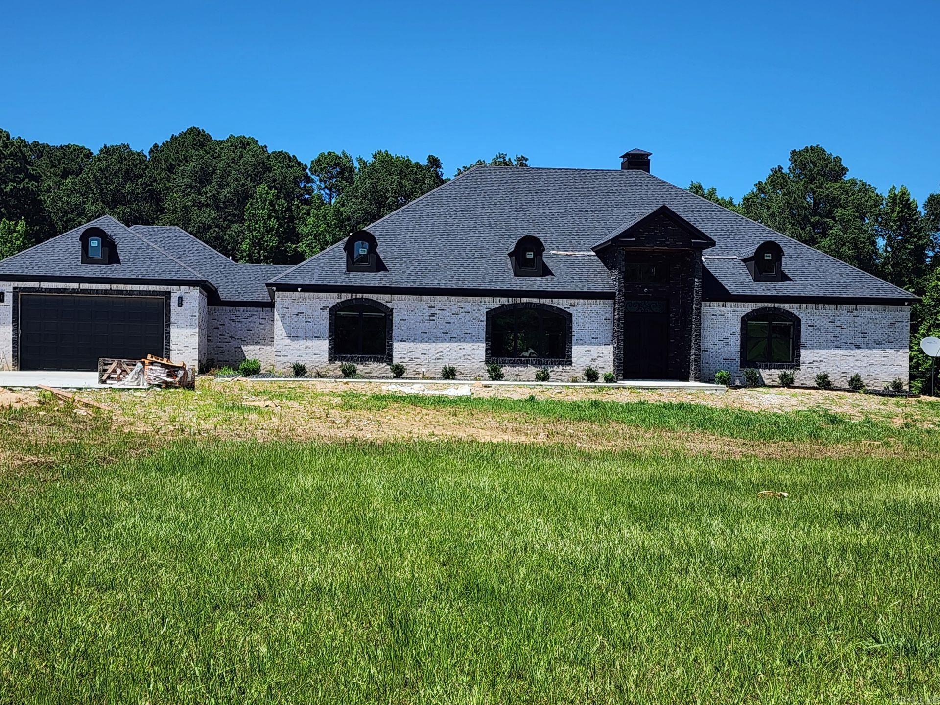 Beautiful custom built home. 4,914 sqft of privacy that sits on 6.03 acres. Minutes from downtown Little Rock. 4 car garage ( front load & side load), large patio with remote control screens to enjoy enclosed or open. Patio area features 1/2 bath, outdoor kitchen and a separate grill area. Mud Room. Living area that features a large wall wine cabinet along side of the wood burning fireplace. Tornado/storm shelter located in a secluded room. Large laundry room with 2 washers and 2 dryers. Office could be used as a 4th bedroom. This beauty has to many features to name.