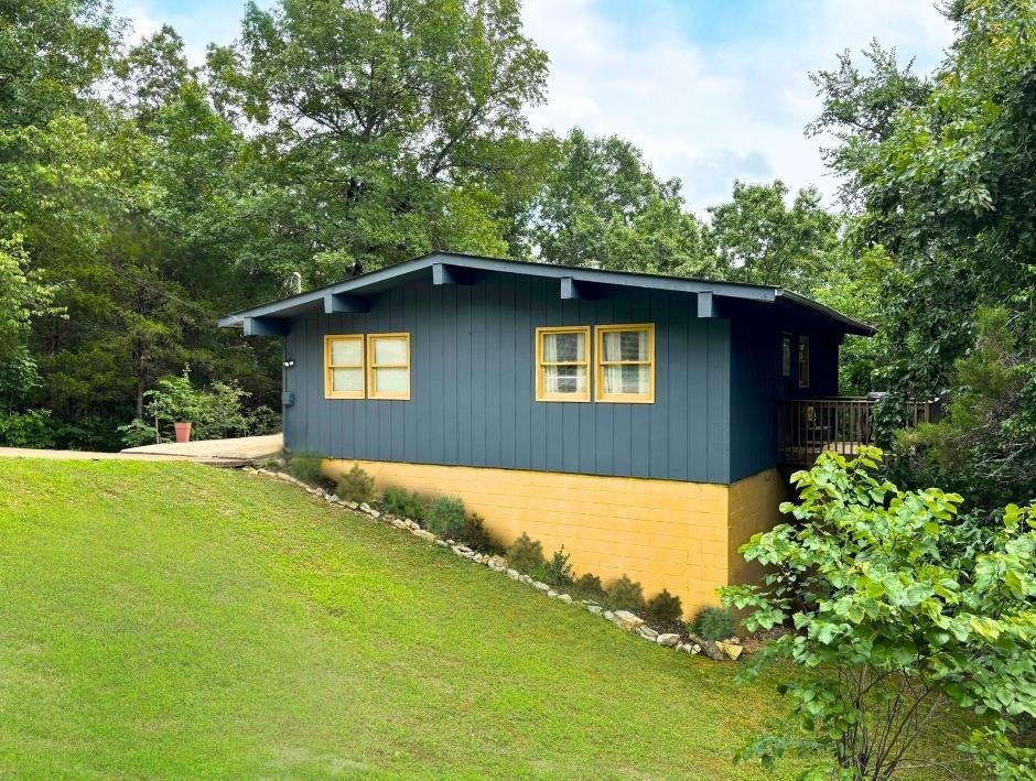 4 Apopka Trace in Cherokee Village offers a peaceful, nature-rich setting wrapped around a thoughtfully updated 2-bed, 1.5-bath split-level home with a partially finished basement that already includes a half bath plumbed for a future shower. Recent improvements such as fresh flooring, updated paint, modern appliances, and a newer roof bring comfort and confidence, while three separate decks give you multiple vantage points to enjoy the surrounding scenery and wildlife. Tucked away for seclusion yet conveniently just off Wabash, this property keeps you close to town amenities, the South Fork River, and the nearby golf course, making it an ideal blend of privacy, recreation, and everyday convenience.
