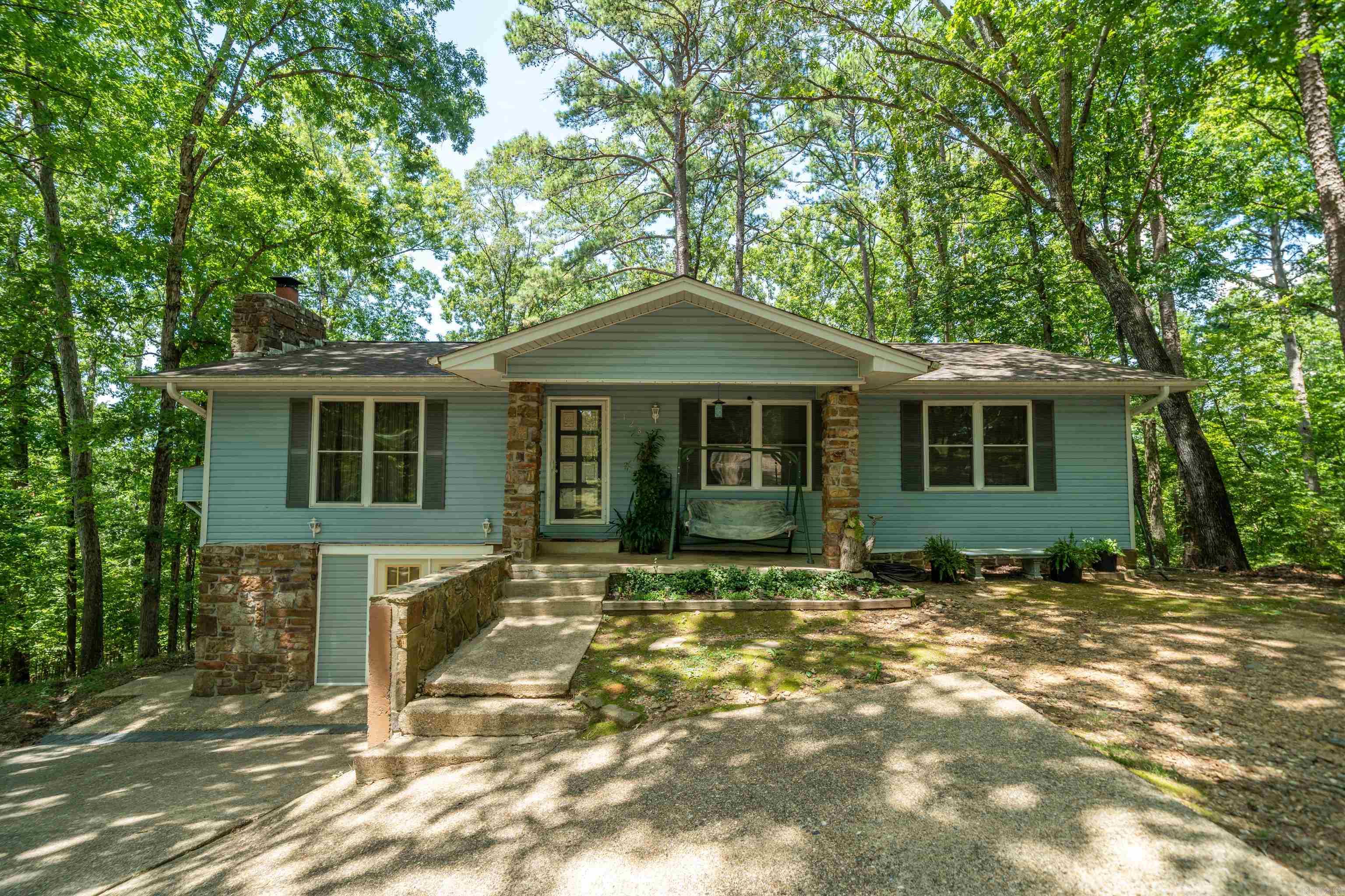 Nestled in a peaceful, wooded setting of Diamondhead Golf & Gated Community, This 3 bedroom 2 bath home offers the perfect blend of privacy & comfort. Step inside to a spacious layout & inviting living spaces, ideal for entertaining. The finished basement adds valuable extra living space for a game room or an office. Enjoy the privacy of the large deck overlooking the peaceful wooded backyard. The community offers a golf course, tennis courts, swimming pool, club house, restaurant, marina & lake access. **The 1896 sqft includes the finished basement/gameroom. Sqft per seller