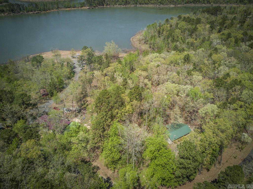 Your Lakefront Lifestyle Awaits!  Nestled near the sparkling shores of Greers Ferry Lake, this beautiful 0.80 acre lot offers the perfect opportunity to build your dream lake home. Just a short walk to the public boat launch, where you will enjoy easy access to fishing, boating, and endless fun!  With the right clearing, this property could offer serene lake views and a peaceful, private setting surrounded by nature. Whether you’re looking for a weekend getaway or a full-time residence, this provides the ideal canvas for your vision.  Don’t miss this chance to own your slice of Greers Ferry paradise! SEE AGENT REMARKS!