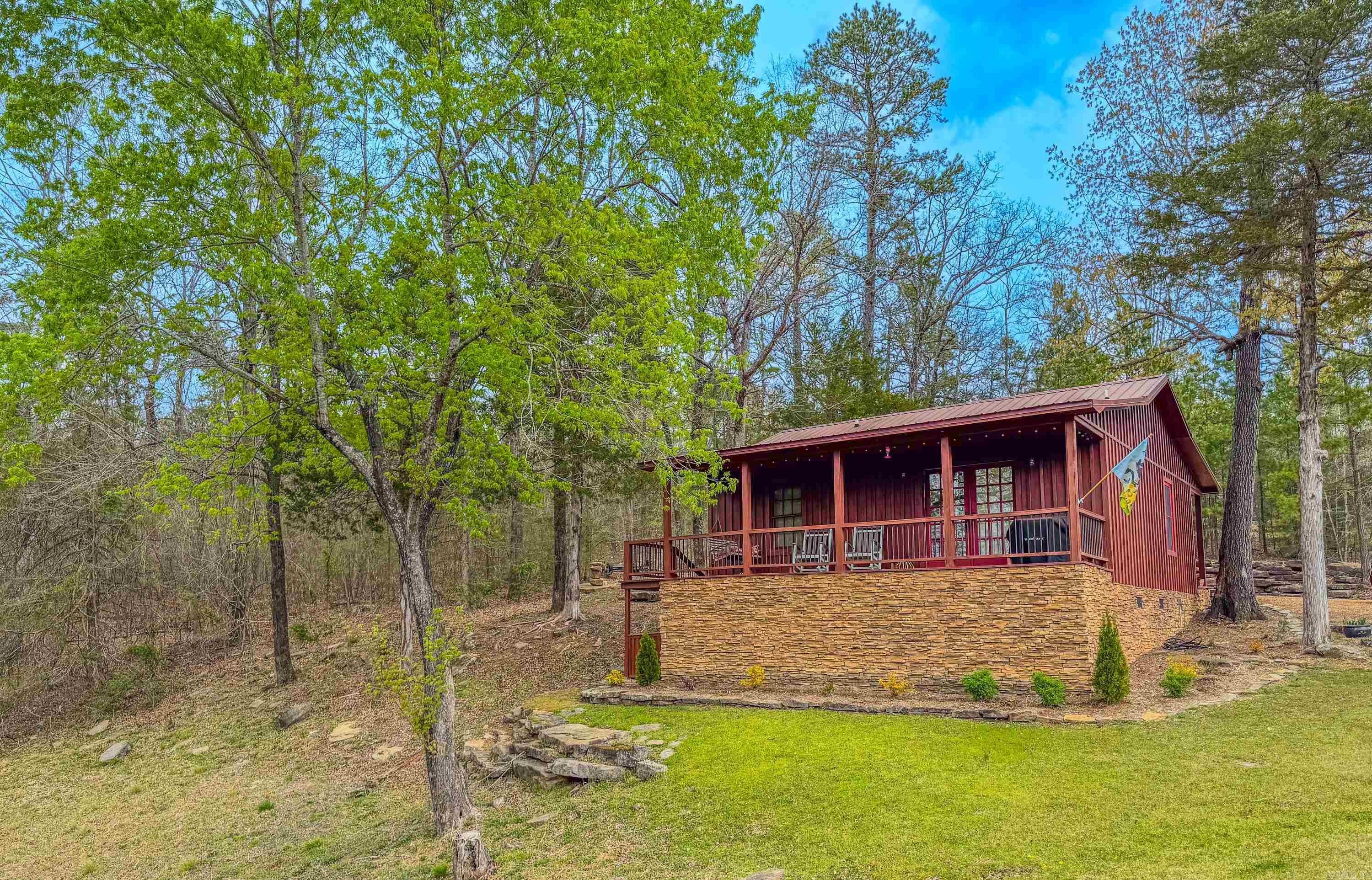 Are you dreaming of retreating to the beautiful Little Red River? This picturesque cabin is nestled in the heart of a gorgeous gated community and comes completely furnished. Featuring 2 bedrooms and 1 bath, this charming getaway offers new flooring throughout, a recently remodeled shower, and the added peace of mind of a backup generator. Enjoy access to modern community amenities, including a private community pool, boat ramp, and dock on the Little Red River. Located just minutes from Greers Ferry Lake, hiking trails, and world-class trout fishing, this cabin offers the perfect way to experience all the Natural State has to offer. Your dream retreat is only an offer away!