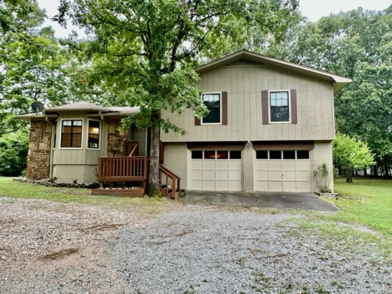 Don't miss this opportunity for this great 3 BR home located on 3 beautiful acres plenty of room for gardening and other projects.  Sprinkler system runs on well, house on city water.  Two decks off back of home, large garden area, acreage cleared of underbrush with large trees remaining.  Bill of Assurance allows for additional home to be built on lot.  Located near Bryant's Springhill Elementary. with easy access to shopping and I-30.