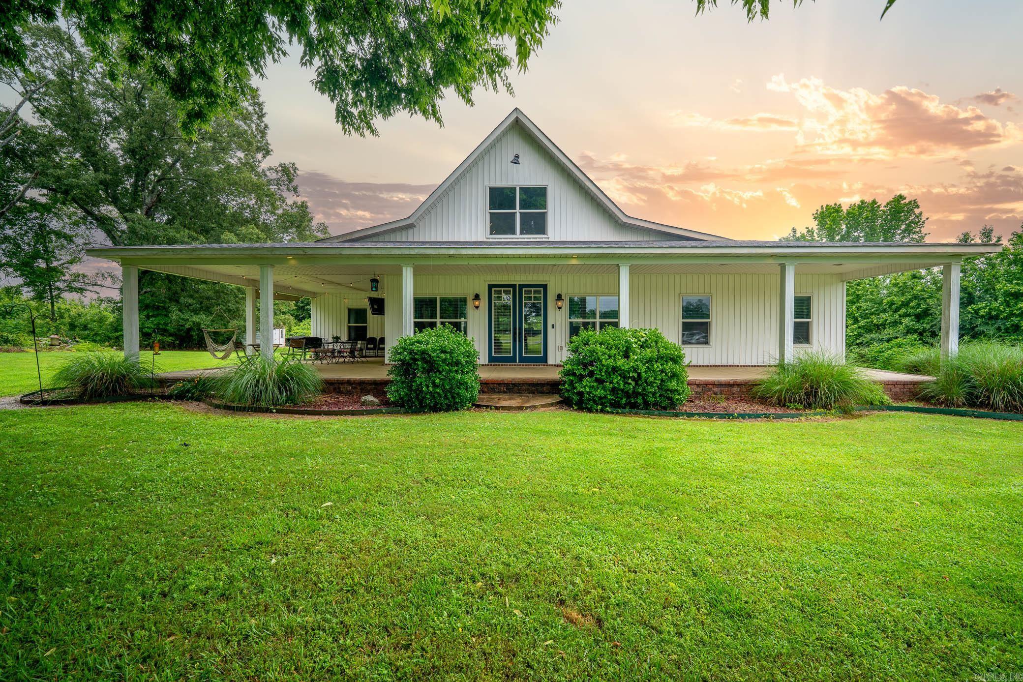 The wraparound porch is the perfect relaxing spot to enjoy this 3,000 sq ft home situated on 2.48 beautiful acres! Featuring 4 bedrooms, 3 bathrooms, and a desirable split floor plan, this open concept layout is designed for comfortable living and entertaining. The spacious living area flows seamlessly into the kitchen, complete with a huge island, granite countertops, 2 pantries, and double wall oven. A spiral staircase leads to a 500 sq ft loft style bonus room perfect for a game room, office, or guest retreat. Step outside to enjoy the partially buried above ground pool with surrounding deck, basketball court, and plenty of room to roam and relax. Paid for solar panels help reduce the electric bill significantly, adding efficiency to this already impressive property!