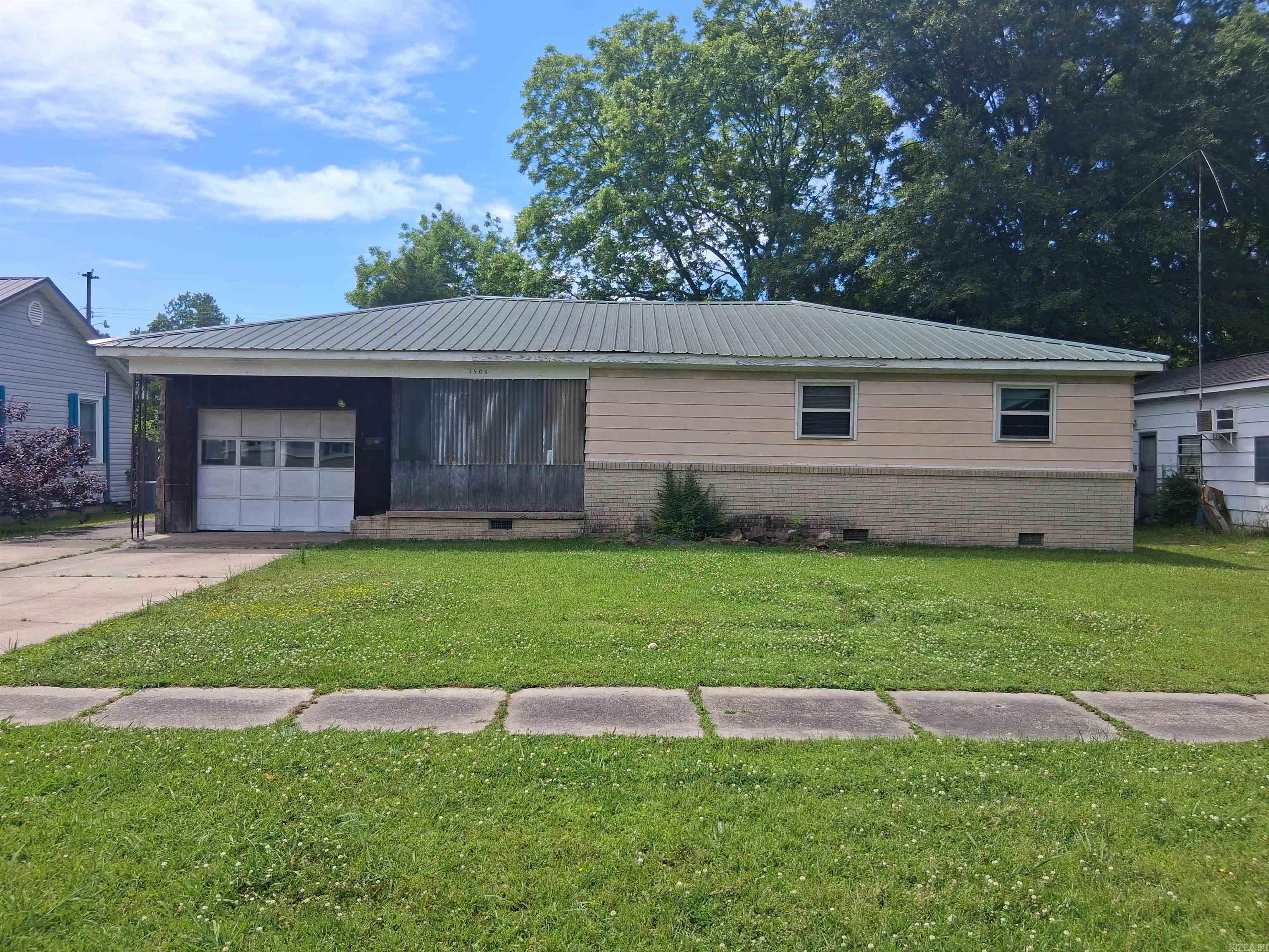 Opportunity awaits at 1508 S Porter Street in Stuttgart, AR! This 3 bedroom, 1 bathroom home offers approximately 1,812 square feet of living space with strong after-renovation value potential for investors, flippers, or buyers looking to add their personal touch. Inside you’ll find a spacious living room, large dining area, separate laundry room, and a functional layout with plenty of room to reimagine the space. Additional features include a 1-car garage, enclosed back porch situated on a concrete slab, and a large storage shed in the backyard for extra storage or workspace needs. Conveniently located with plenty of upside potential, this property is ready for its next chapter. Schedule your showing today!