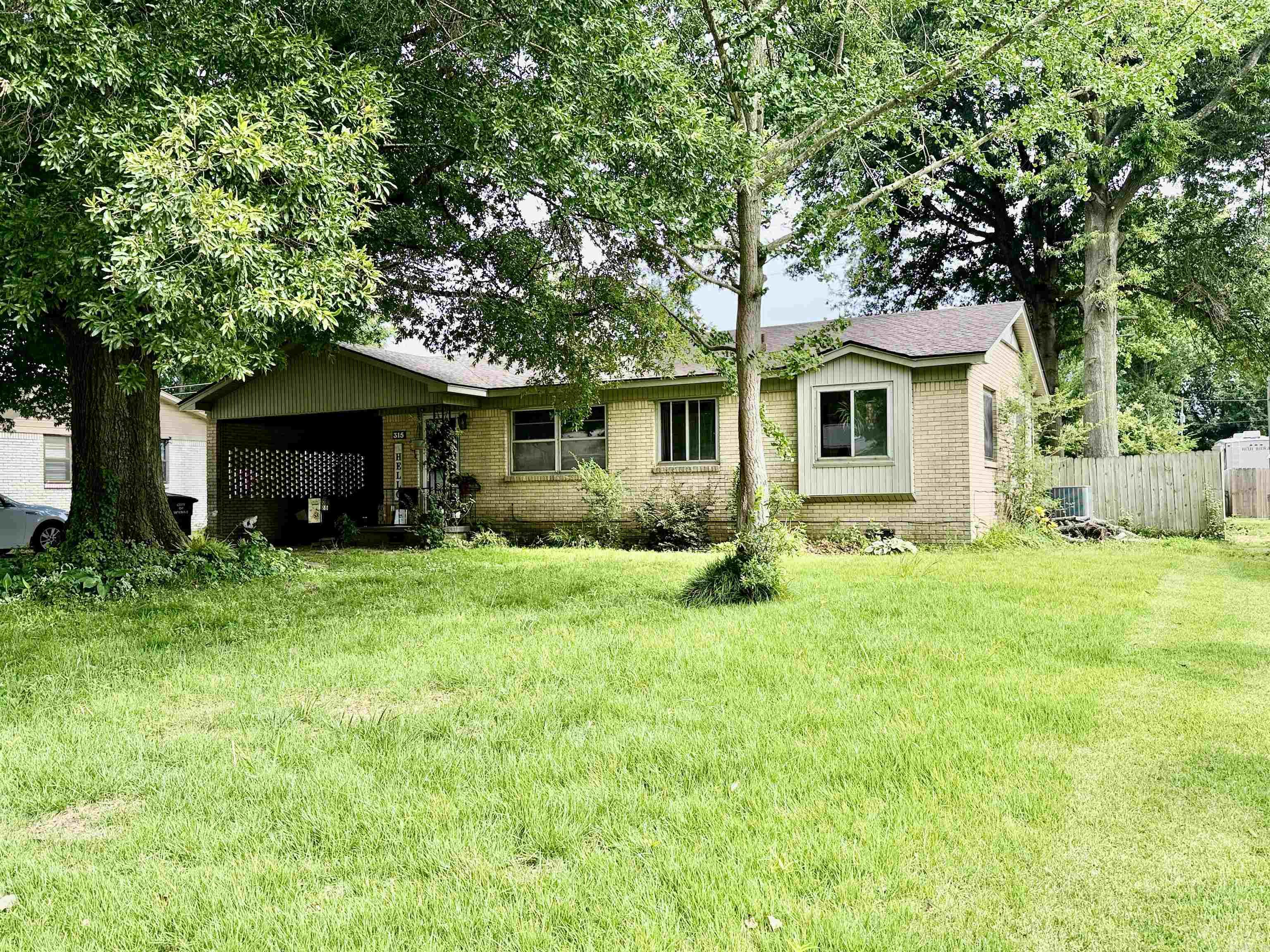 Welcome to this Spacious Brick Home with a huge Family room addition, has backyard access to a covered Patio and open Patio. A convenient Drive through gate, wood fenced back yard with a large storage building.  The interior has 3 Bedrooms and 2 baths, Primary Bedroom has private bathroom.  There is an extra room for Office, crafting etc.  The Laundry room is separate with a large storage closet.  The Appliances are new, Refrigerator stays, new Roof, New Central Heat & Air, new plumbing under the house. With over 1700 sq. ft. heated, there is plenty of space for your Family.  Schedule an appointment to see this one soon!!!