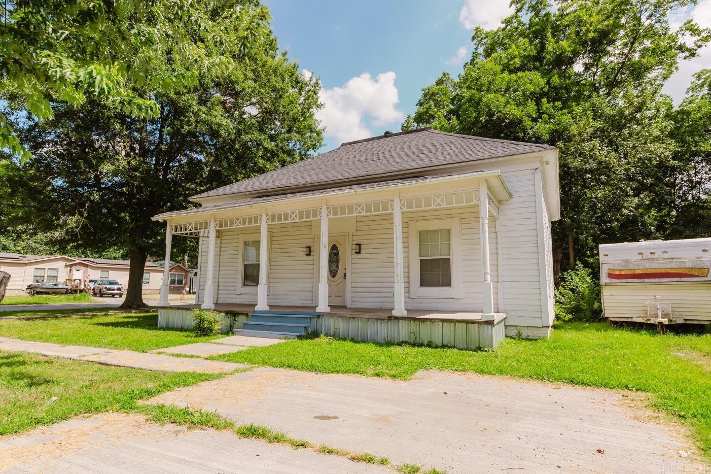 Situated on a spacious corner lot, this fully renovated home combines classic charm with modern updates. Inside, you'll find all-new flooring, fresh neutral paint, and an updated kitchen designed for everyday living. The formal dining room provides a great space for gathering, while the generously sized bedrooms offer comfort and flexibility. A separate laundry room adds convenience, and the inviting front porch is the perfect spot to relax and enjoy the neighborhood. Move-in ready with thoughtful updates throughout, this home is ready for its next owner to make it their own. The roof, HVAC, water heater, appliances, windows, bathrooms - ALL NEW and part of the renovation.