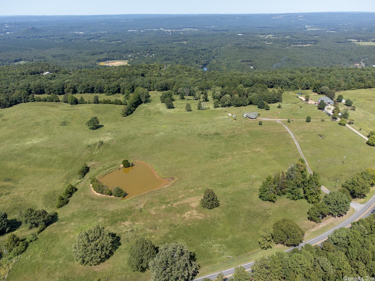 Welcome to Market 2465 Pangburn Rd. aka Highway 16 of Heber Springs, AR within the Heber Springs School District. A sprawling 45.40 +/- acres of pasture and timberland conveniently located near renowned Greer's Ferry Lake, the Little Red River, and Sugarloaf Mountain. The perimeter is cross fenced, and contains a covered 4 car carport, a wraparound deck, 2 outbuildings, and 2 ponds.  If you're a nature lover, this location is for you.  Call today to schedule your tour and make an investment in tomorrow.